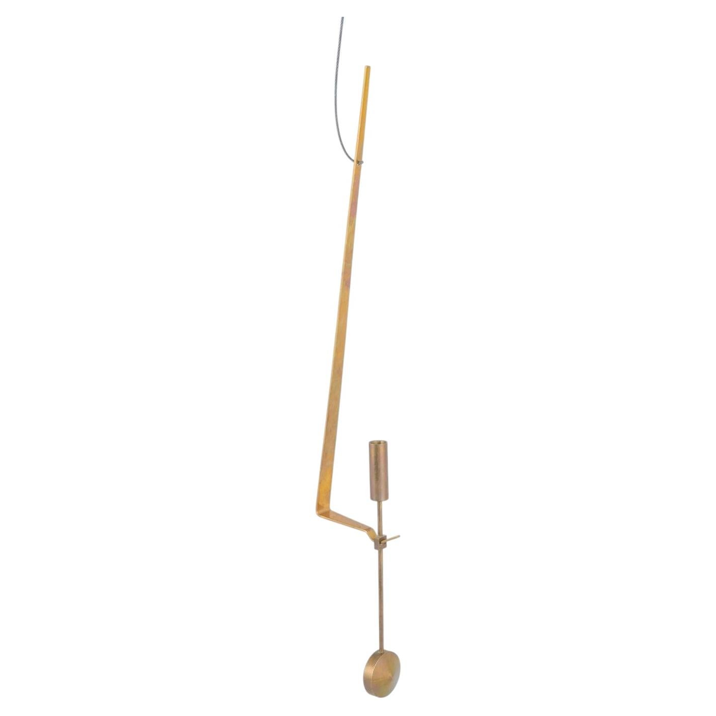 Pierre Forsell, Skultuna. Wall candle holder in brass with pendulum suspension For Sale