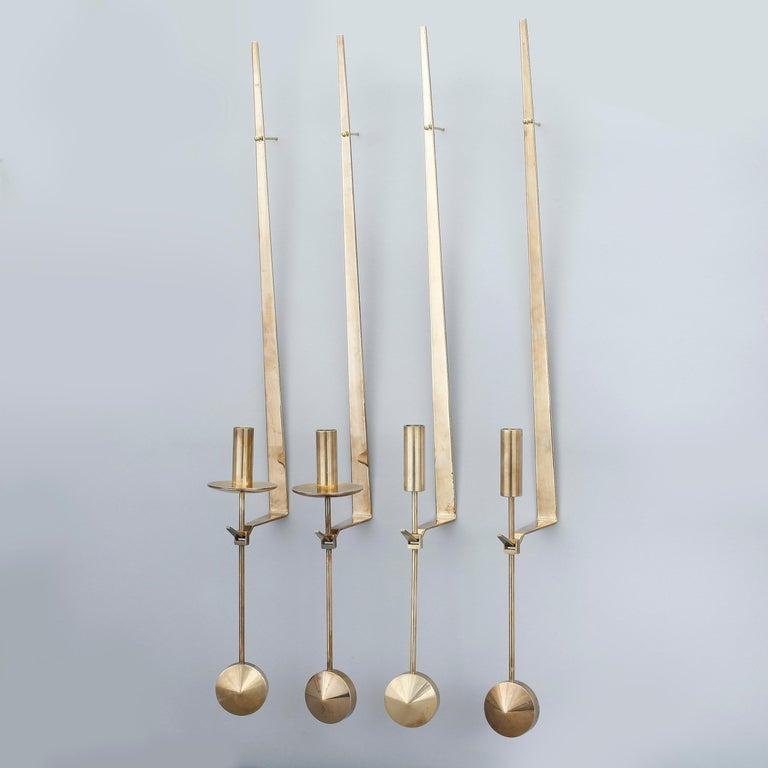 Brass wall mounted candle holders by pierre Forsell, 10 items available. 
good condition with wick holder
Price by item.