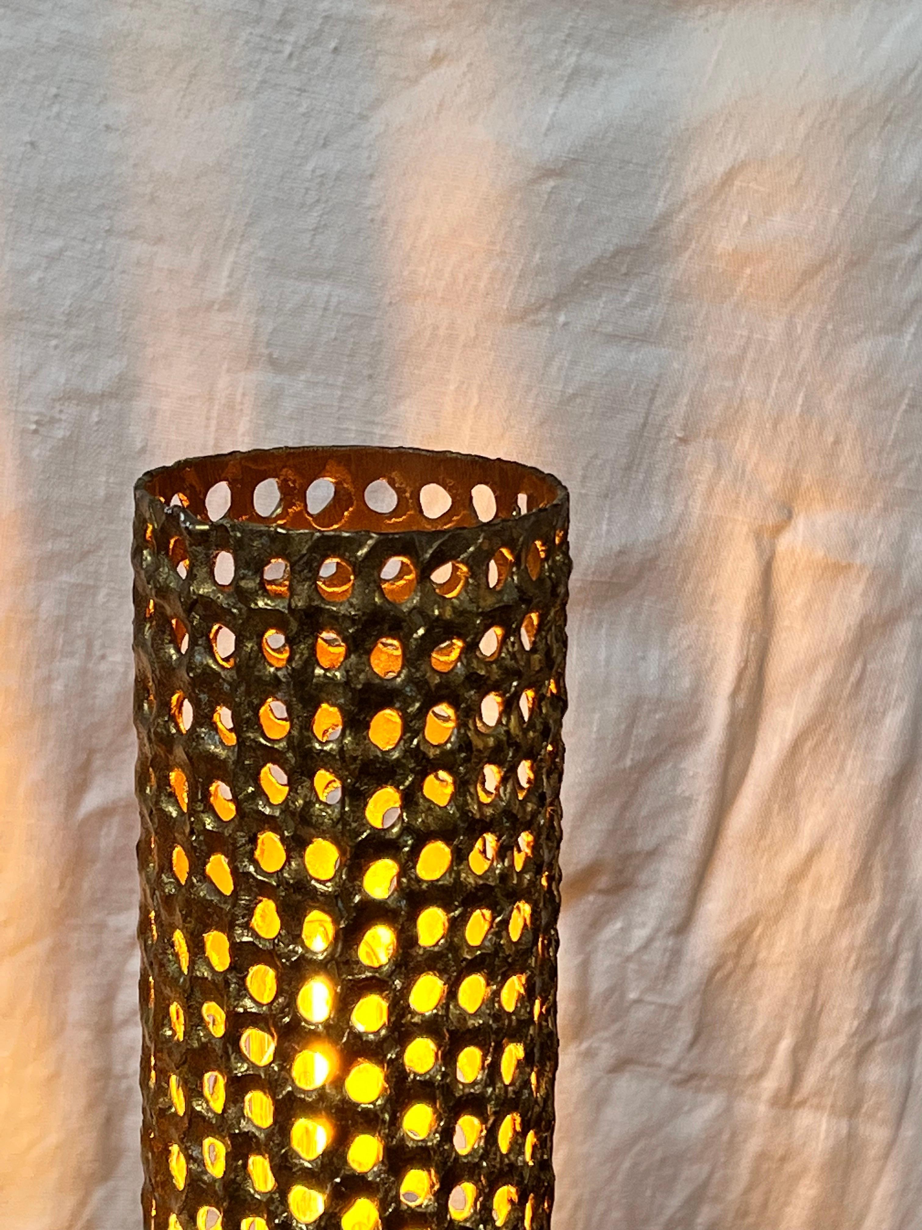 This table lamp was hand crafted in 1975 and 1978 at the Skultuna studio were Pierre Forssell was working with he's assistant. The lamp is made of a brass tube where some holes were drilled with the torch by these skilled craftsmans. Simple, minimal