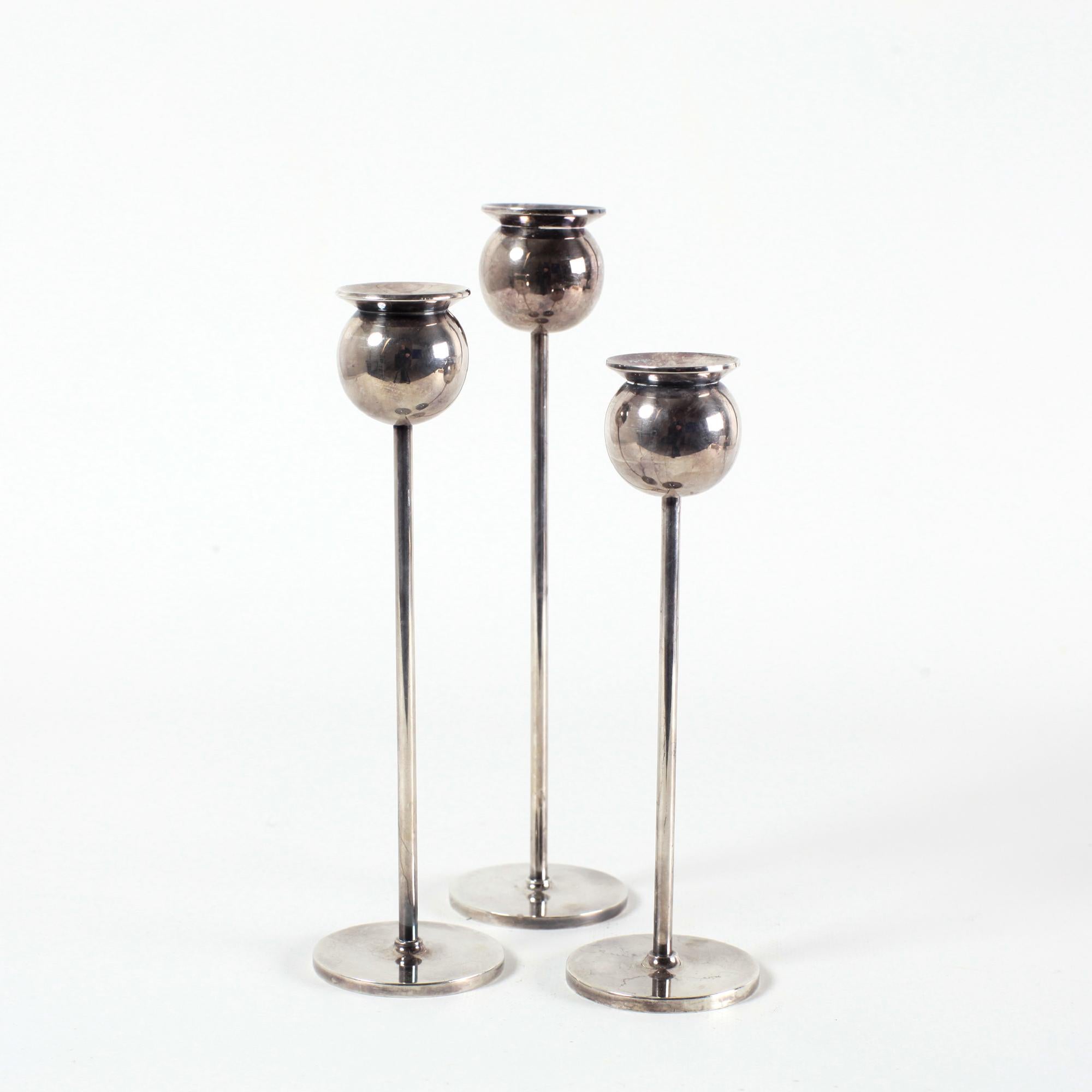 Set of  three rare nickel candlesticks model Tulip by Pierre Forssell for Skultuna Sweden 70s.
Skultuna was founded by King Karl IX in 1607 and has been a Purveyor to the Royal Court of Sweden ever since.
The Silversmith Pierre Forssell is one of