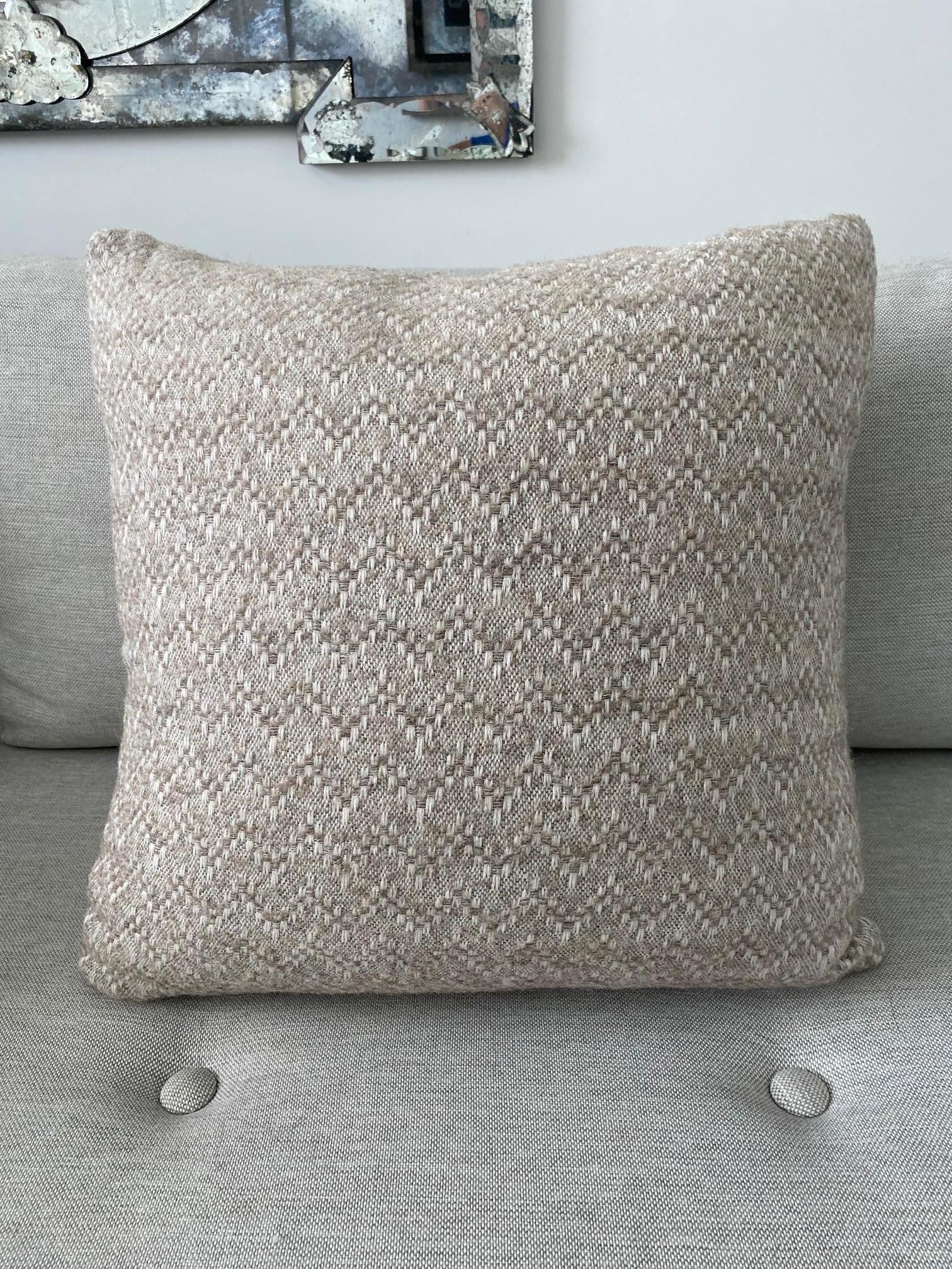 Handcrafted throw pillow made in Pierre Frey's Eva Racine. The large pillow features a blend of organic alpaca, mohair, and merino wools to create this stunning woven textile with a modern chevron pattern. Pillow features the same fabric on both