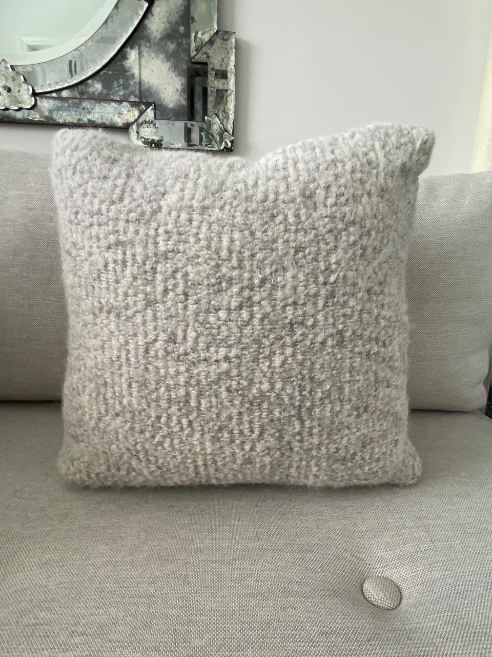 Handcrafted pillow made with Pierre Frey’s Scarlette boucle in color Plume, featuring a blend of alpaca, mohair, and merino wools to create this stunning woven texture. The reverse side of the pillow is equally as beautiful and features full grain