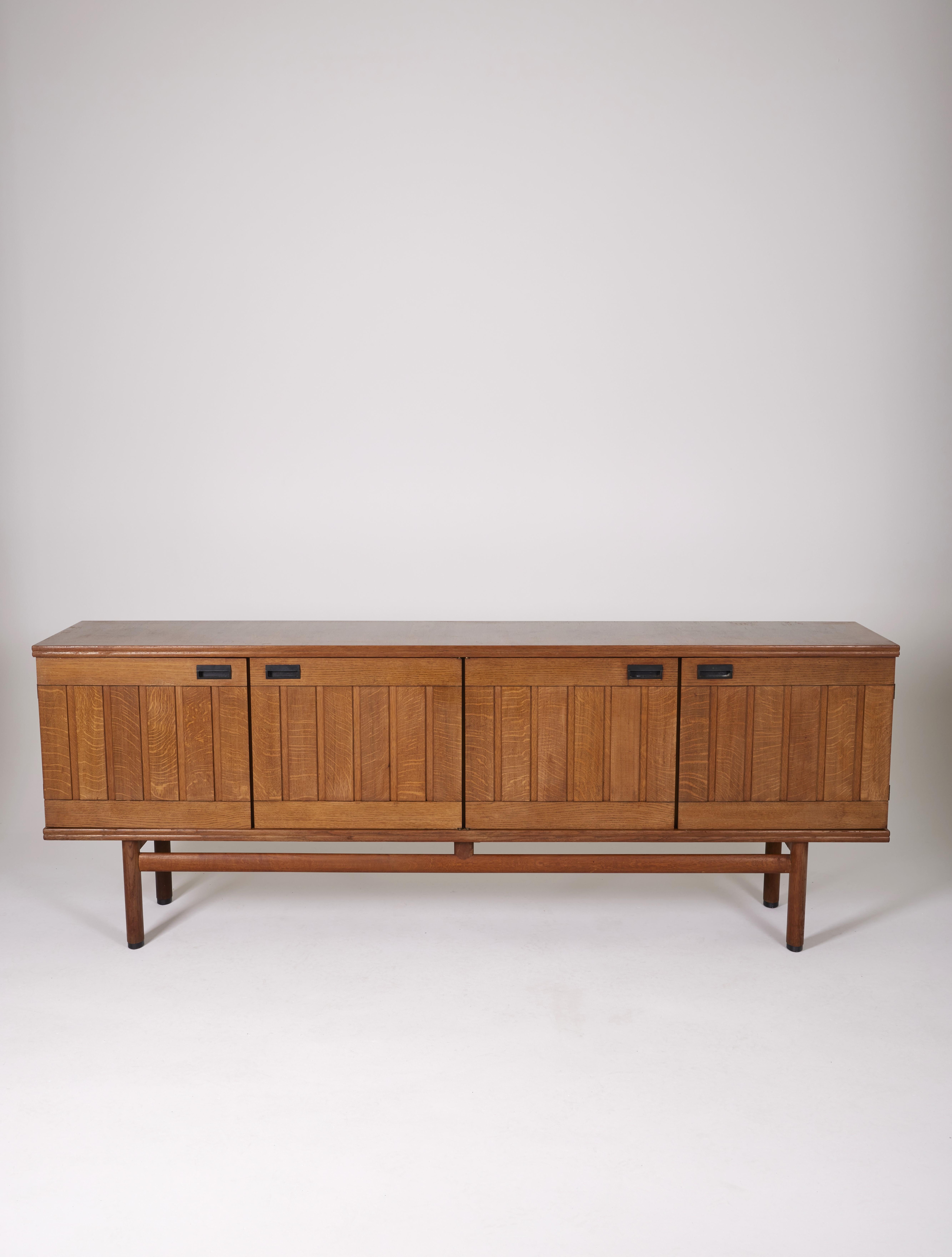 Sideboard by Pierre Gautier-Delaye, France 1950s. Composed of 4 doors, a base with brace and handles in black lacquered aluminum. Very good condition, some traces of use.