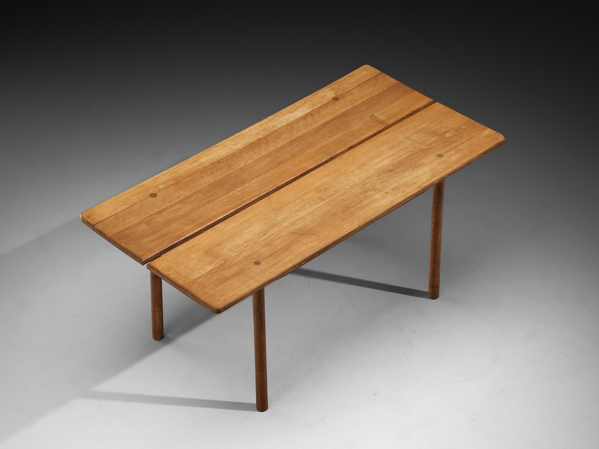 Pierre Gautier-Delaye, dining table, solid beech, France, 1950s

This French dining table, designed by Pierre Gautier-Delaye, is executed in beechwood and features a beautifully patinated surface that speaks to its age and character. The tabletop is
