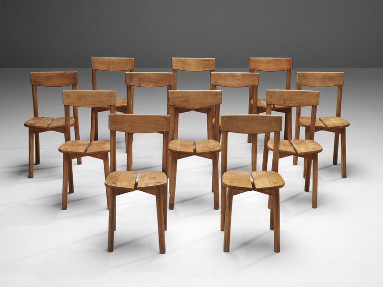 Pierre Gautier-Delaye, set of Twelve dining chairs, beech, France, 1960s

This set of subtle and modest dining chairs are executed in stained beechwood. The seating area is divided into two organically shaped slats and is detailed with wood-joints