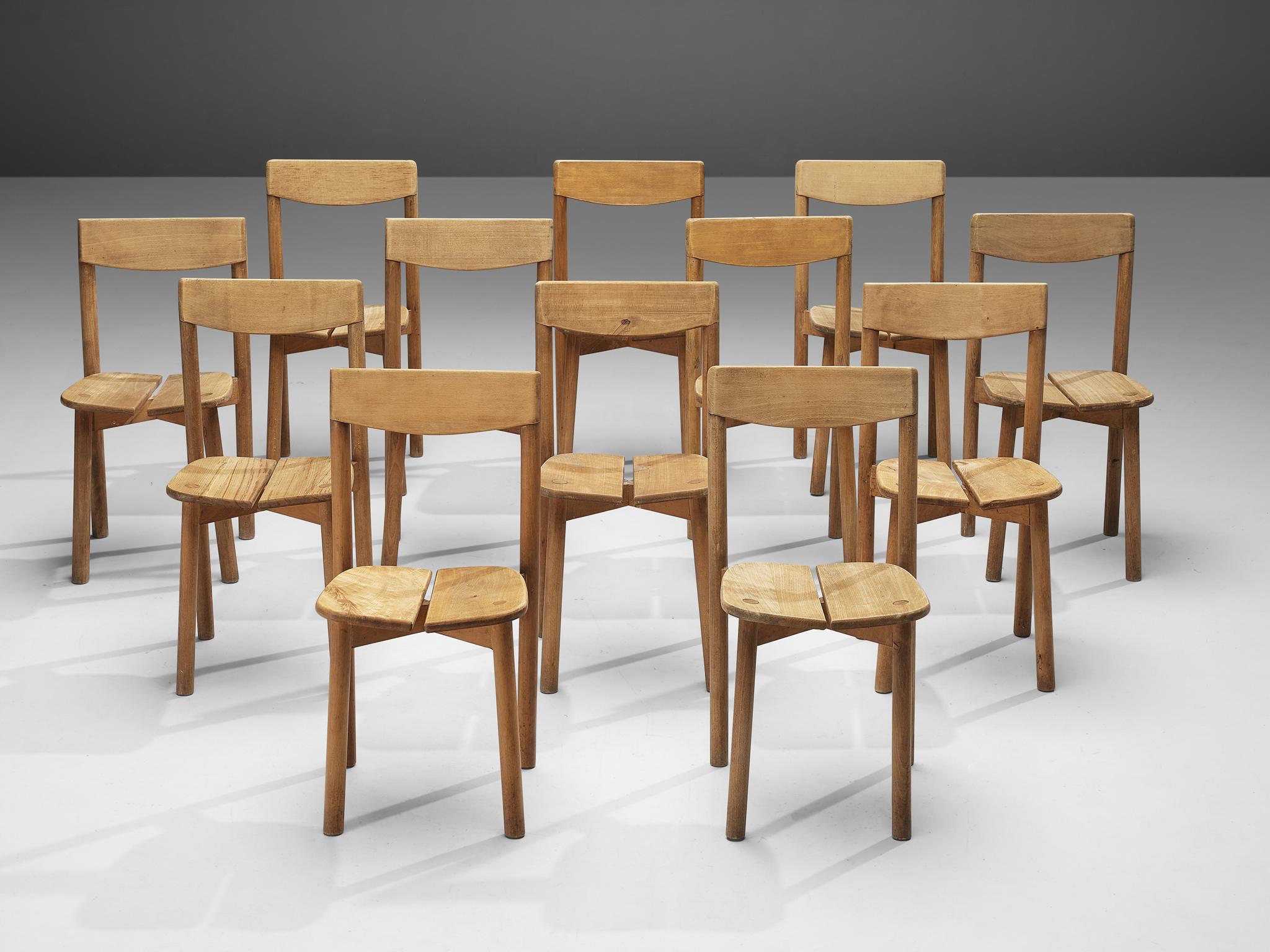 Pierre Gautier-Delaye, set of twelve dining chairs, beech, France, 1960s

This set of subtle and modest dining chairs are executed in stained beechwood. The seating area is divided into two organically shaped slats and is detailed with wood-joints