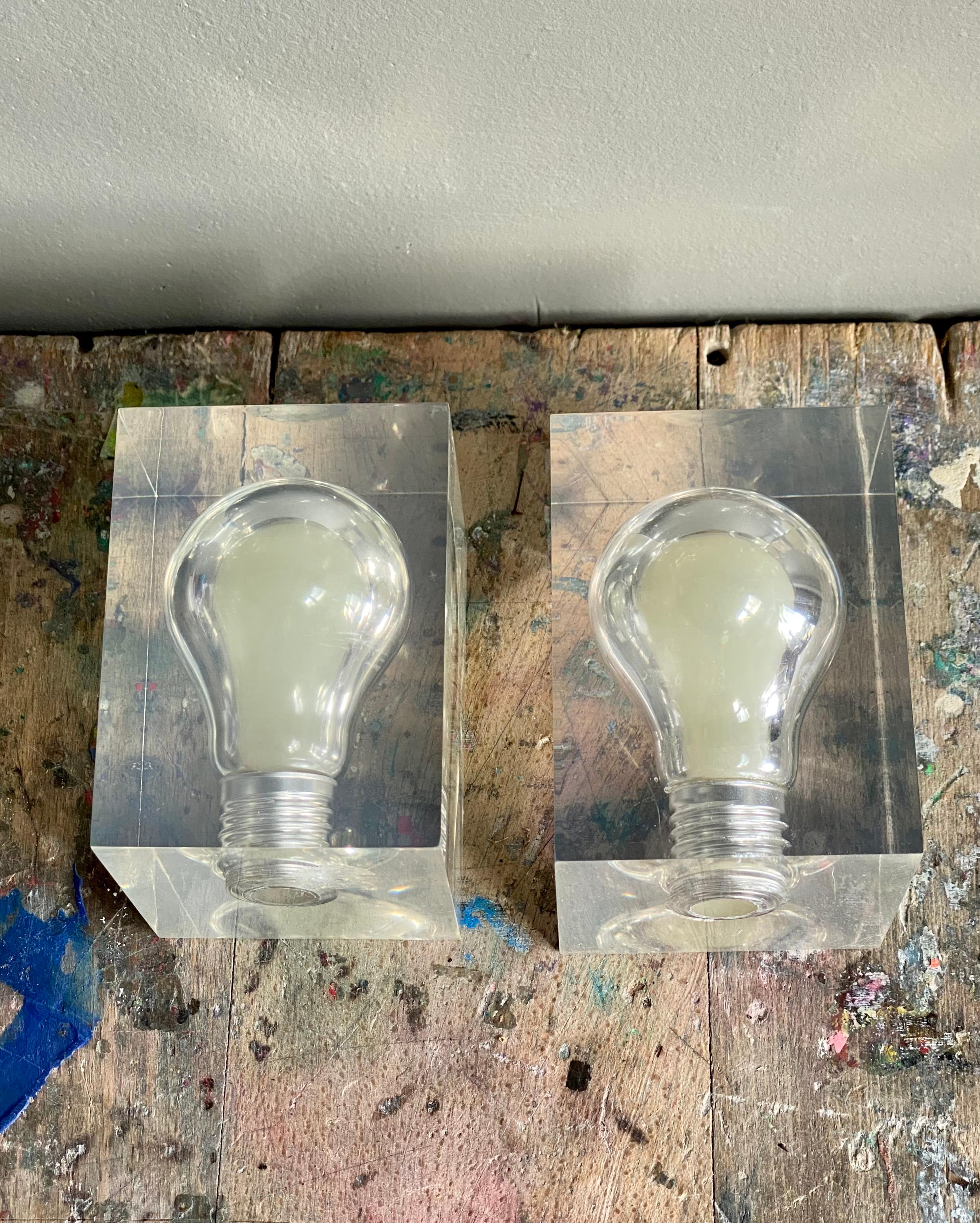 Very cool vintage Pop Art item, this glow in the dark lightbulb inside a Lucite box. Often used as a decorative piece, or a presse papier but it can also easily be used as a night lamp in a child’s bedroom while it can stay ‘switched’ on the whole
