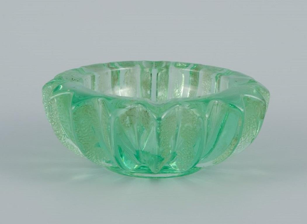 Pierre Gire (1901-1984), aka Pierre d'Aesn, France.
Green art glass bowl.
Art Deco style.
Approx. 1940s.
Perfect condition.
Dimensions: D 13.5 x H 5.5 cm.

Pierre Gire (1901-1984), alias Pierre d'Enesn.
He worked at Rene Lalique for 10
