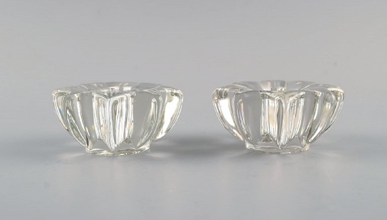 Pierre Gire (1901-1984), aka Pierre d'Avesn.
A pair of Art Deco candle holders in clear art glass. 1930s / 40s.
Measures: 8.5 x 4 cm.
In excellent condition.
Stamped.

Pierre Gire (1901-1984), aka Pierre d'Avesn. 
In the beginning, at 14
