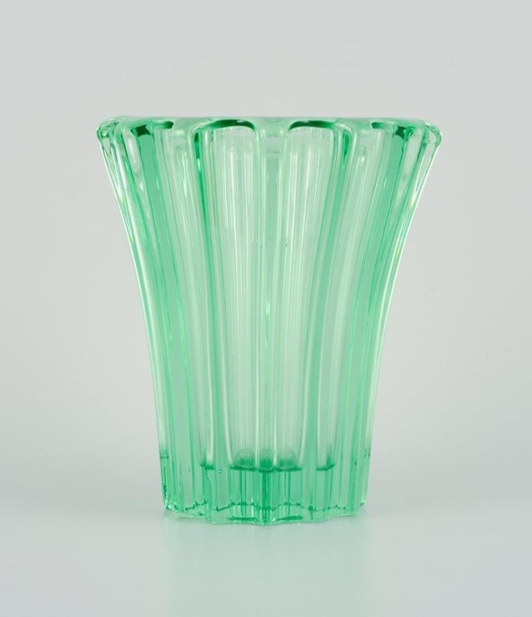 Pierre Gire (1901-1984), aka Pierre d'Avesn.
Art Deco vase in green art glass.
1940s. 
Signed.
In excellent condition, with a small chip on the bottom. 
Dimensions: H 16.5 cm x D 14.0 cm.

Pierre Gire (1901-1984), alias Pierre d'Avesn, began working
