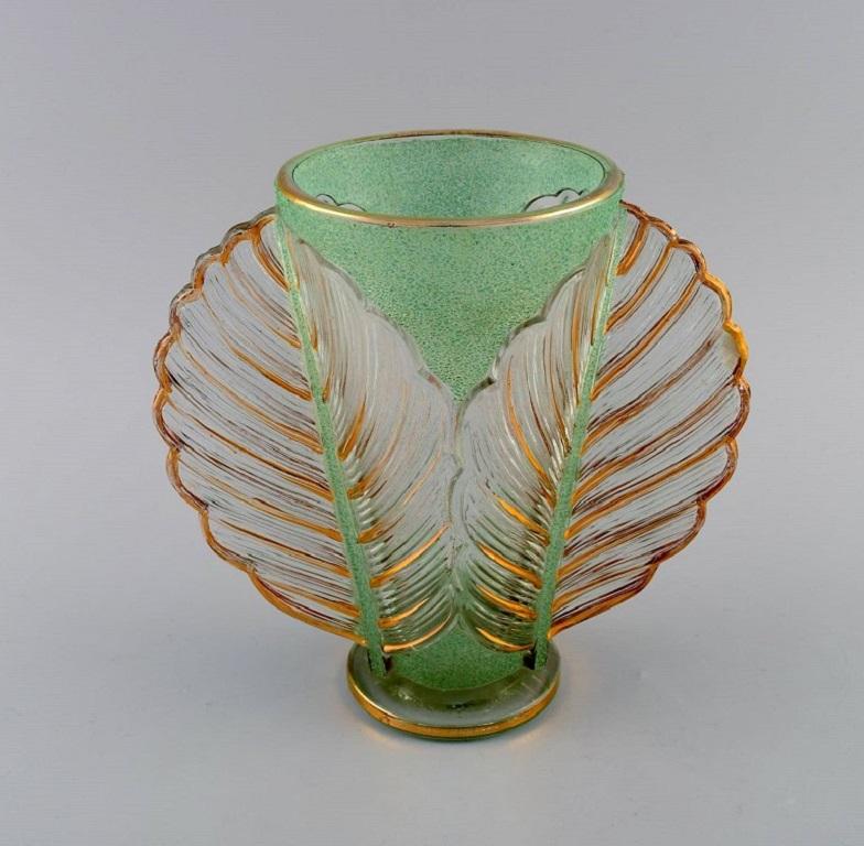 Pierre Gire (1901-1984), aka Pierre d'Avesn.
Rare Art Deco vase in clear and green mouth-blown art glass with gold decoration. 1930s.
Measures: 22 x 20.5 cm.
In excellent condition.
Stamped.