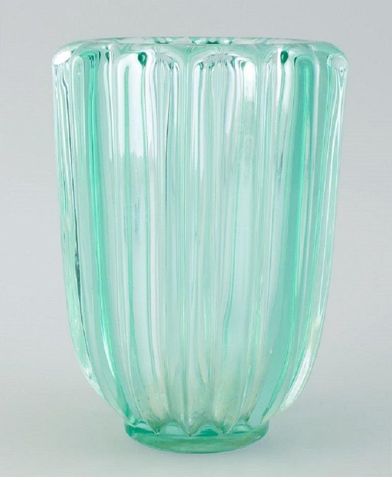 Pierre Gire (1901-1984), aka Pierre d'Avesn. Art Deco vase in light green art glass. 1940's.
Measures: H 18,0 cm. x D 13,5 cm.
In excellent condition with calcium residue in the bottom.

Pierre Gire (1901-1984), aka Pierre d'Avesn. 
In the