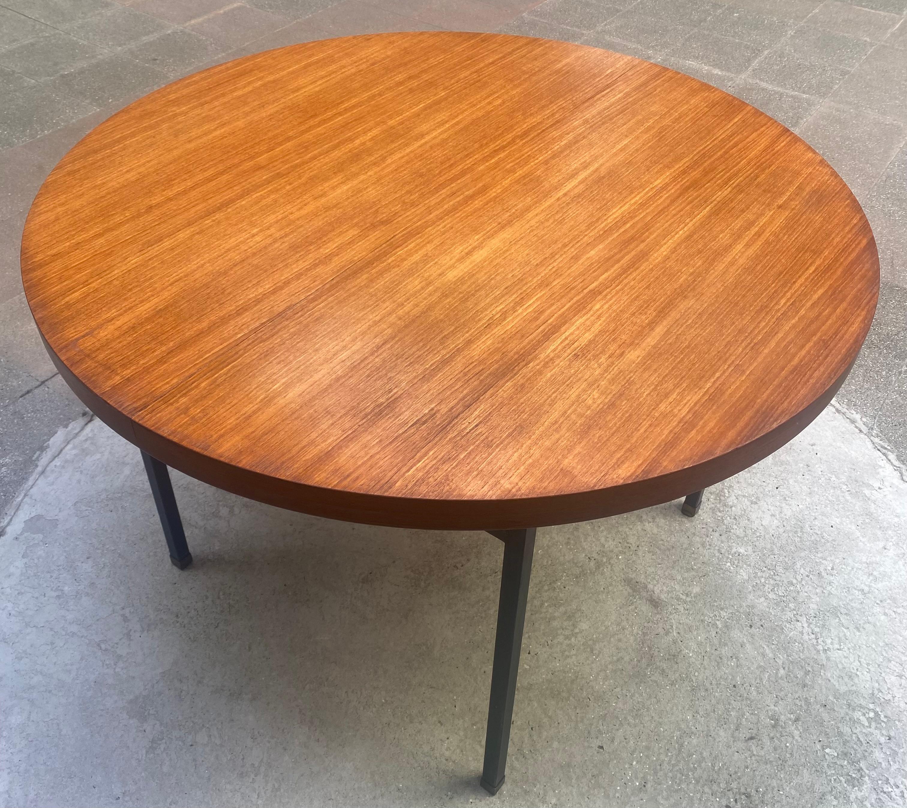 Pierre Guariche dining table. 
Minvielle Edition. 
Materials: Teak and steel.
circa 1960.
Stamped
Dimensions open : L 162 x W110 x H 73 cm.
Dimensions closed : Ø110 x 73 cm.
Blackened steel, steel and brass legs. 
Price : 1100€ for the