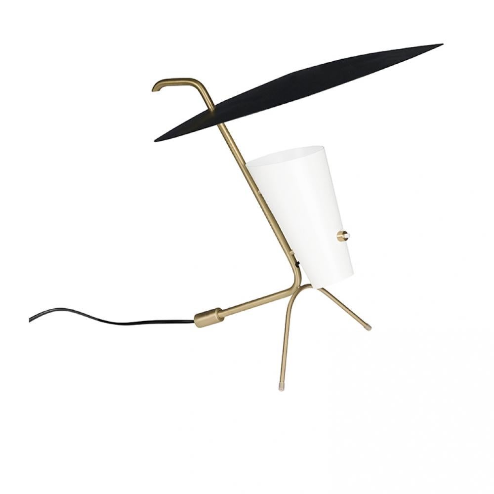 Designed by Pierre Guariche in 1953, this elegant, delicate and sculptural lamp is perfect for a desk, a console or a bedside table.

This iconic lamp is newly produced in an authorized re-edition by Sammode Studio in France using many of the same