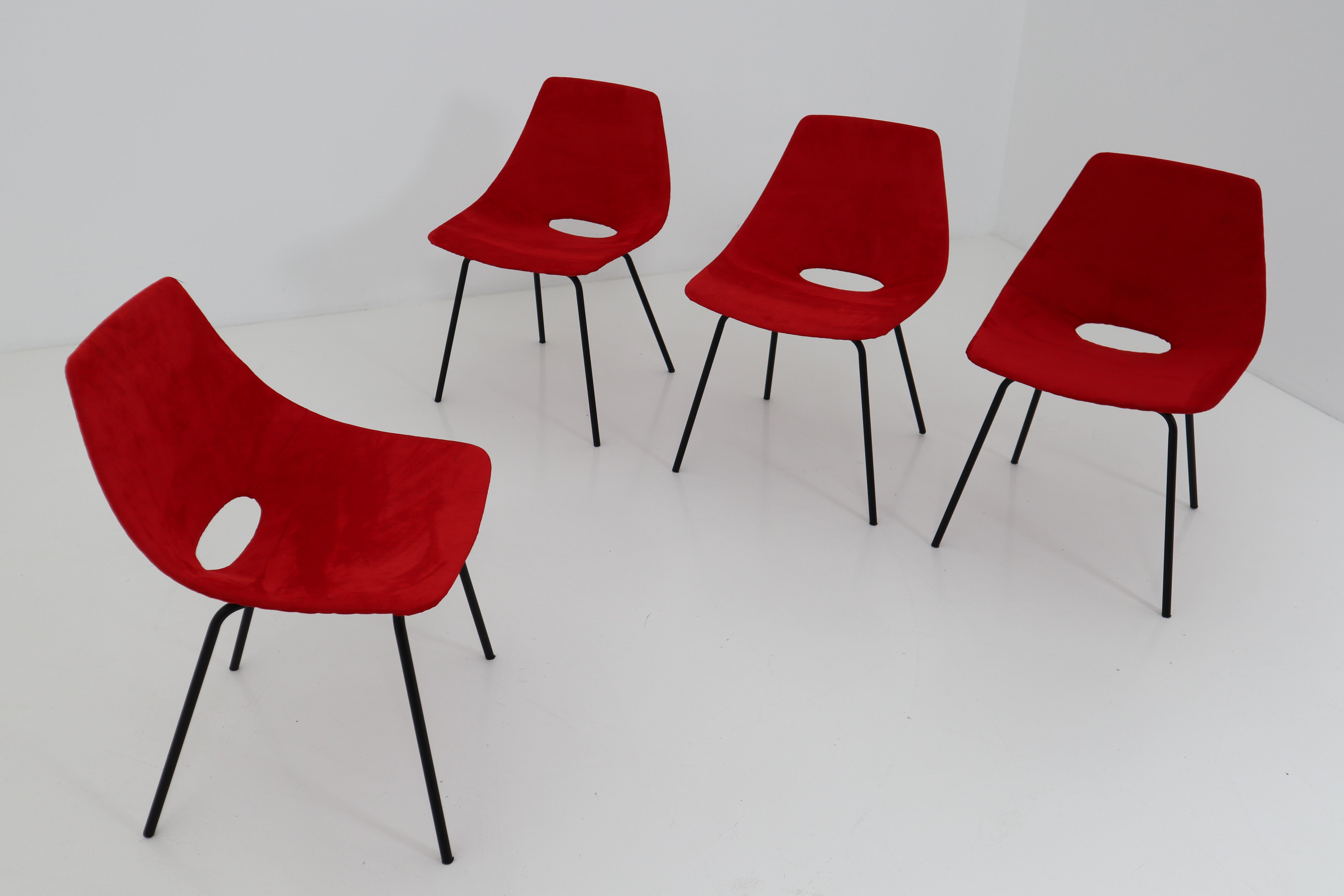 Set of four molded plywood chairs, attributed to Pierre Guariche are newly upholstered in red alcantara high-quality fabric with black lacquered metal legs. The chairs are from 1954 and manufactured by Steiner.