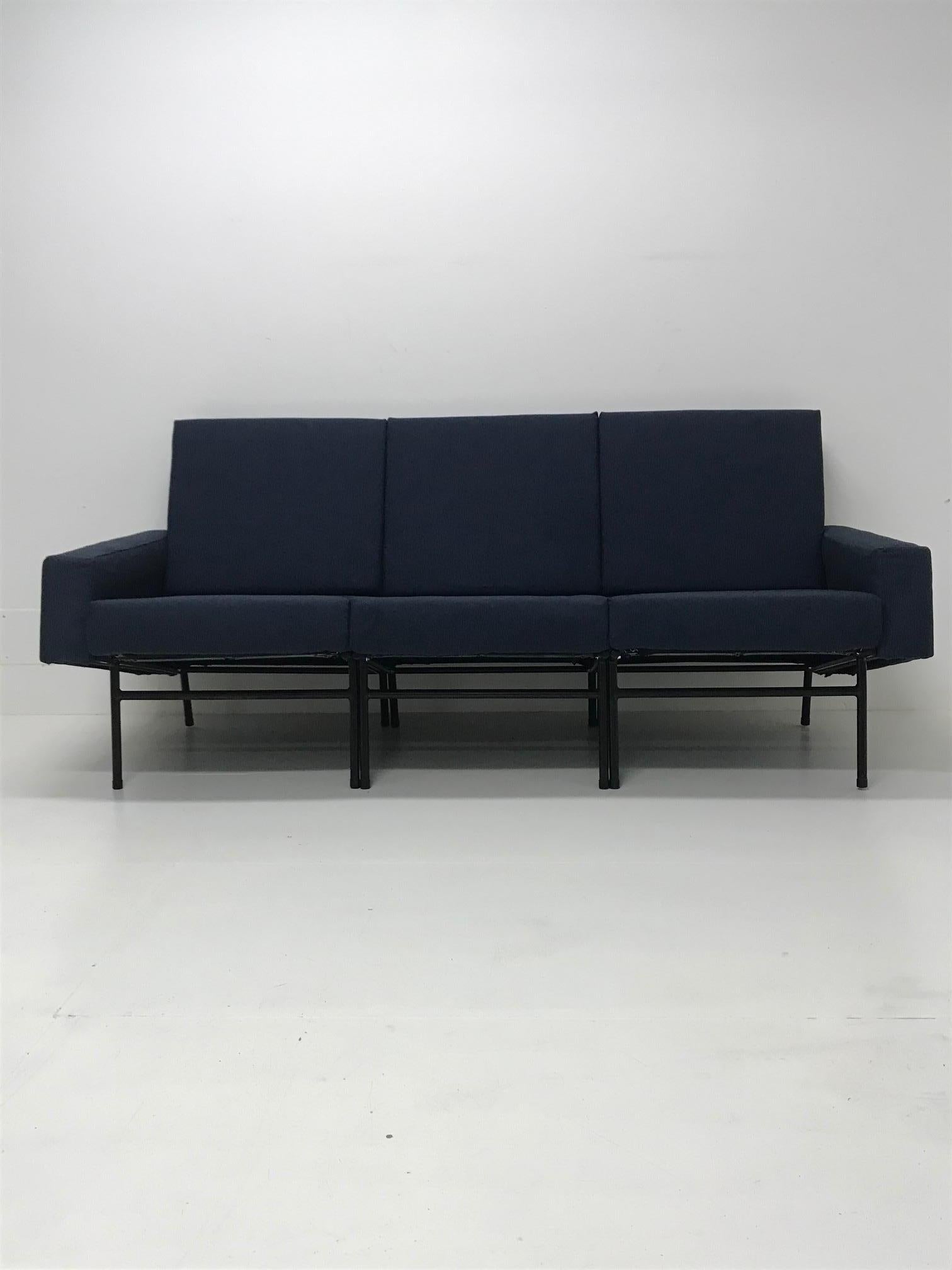 A three-seat sofa by Pierre Guariche for Airborne. Black enamelled steel structure. Newly restored in a royal blue fabric, France, 1950s.
  