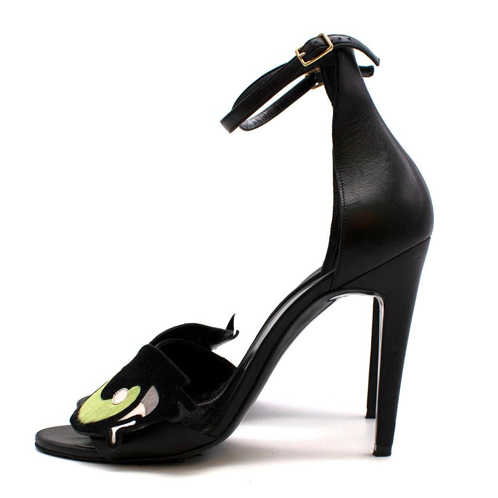 Pierre Hardy Black Leather Heeled Sandals with Eye Detail

-Gorgeous suede, leather and pony hair patchwork details to the front, depicting an eye 
-Hand made 
-Luxurious soft leather lining 
-Ankle strap with golden buckle fastening 
-Stiletto Heel