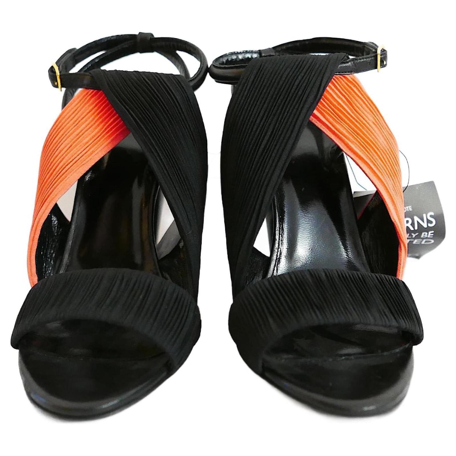 Coolest Pierre Hardy heels, bought for £475 and new with tags. Made from coral and black ruched fabric, they have chunky cone shamed heels and buckle up ankle straps. Size 36.5. Measure approx - 9.5” heel to toe inside and heel is 4.5.
