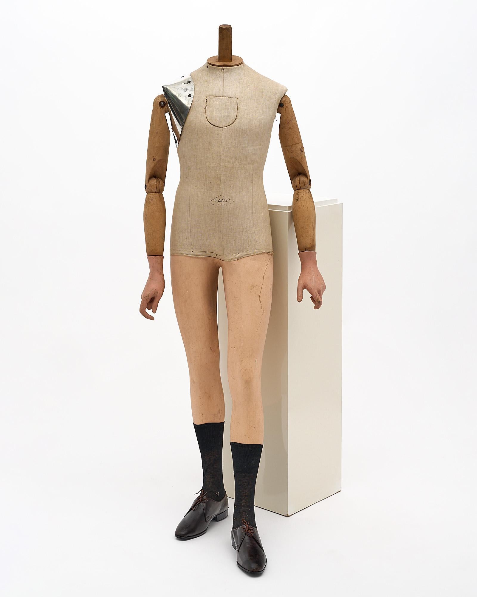 Mannequin Art Déco, by Pierre Imans France circa 1930. This is a very rare male mannequin by famous fashion mannequin manufacturer Pierre Imans. Made out of hand carved wood and linen, the mannequin features also a metal plate on the shoulder and