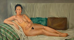 Young woman posing naked on the sofa