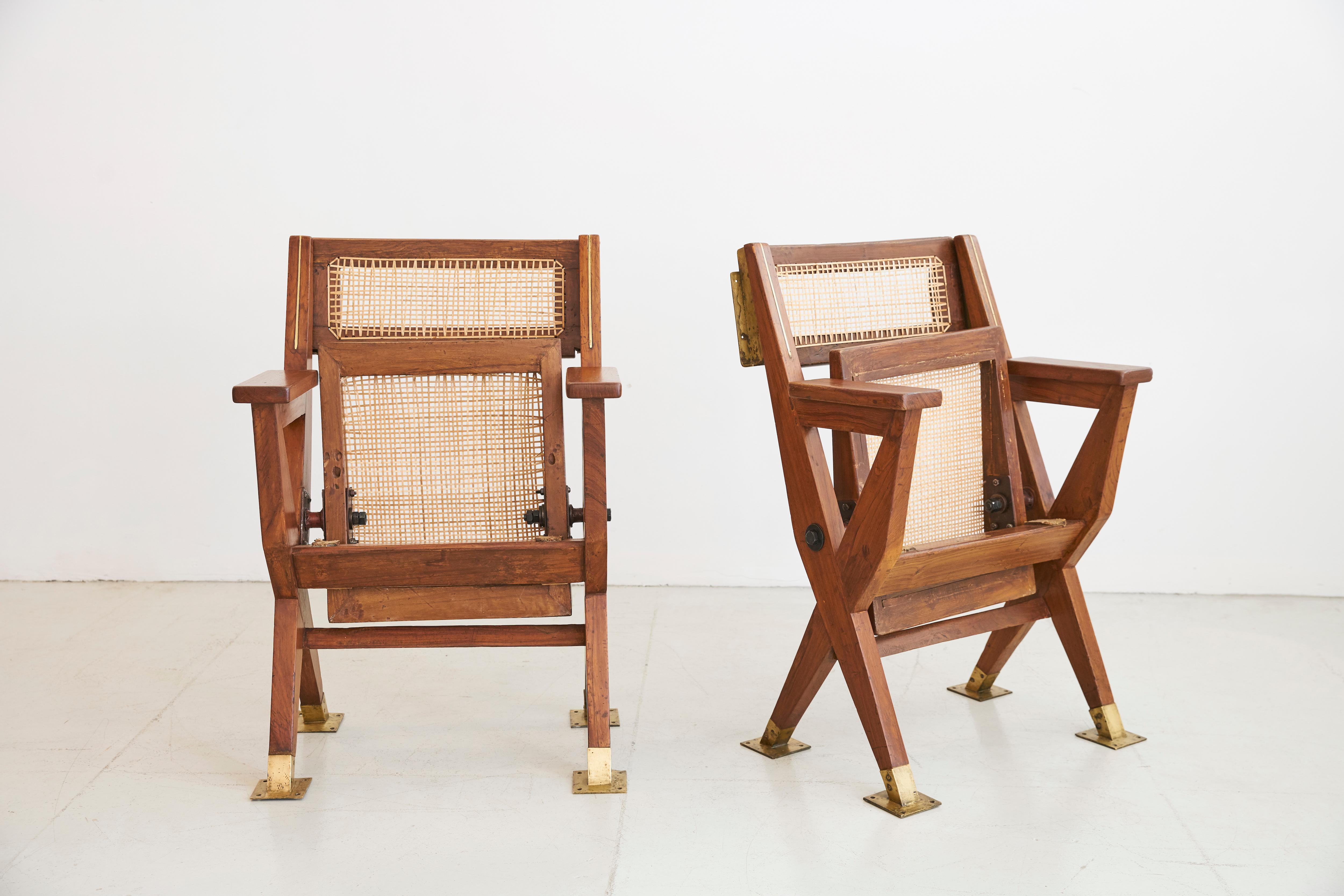 Pair of original folding Cinema chairs from Chandigarh, circa 1960
Teak wood, heavy solid brass fittings and new caning. 

