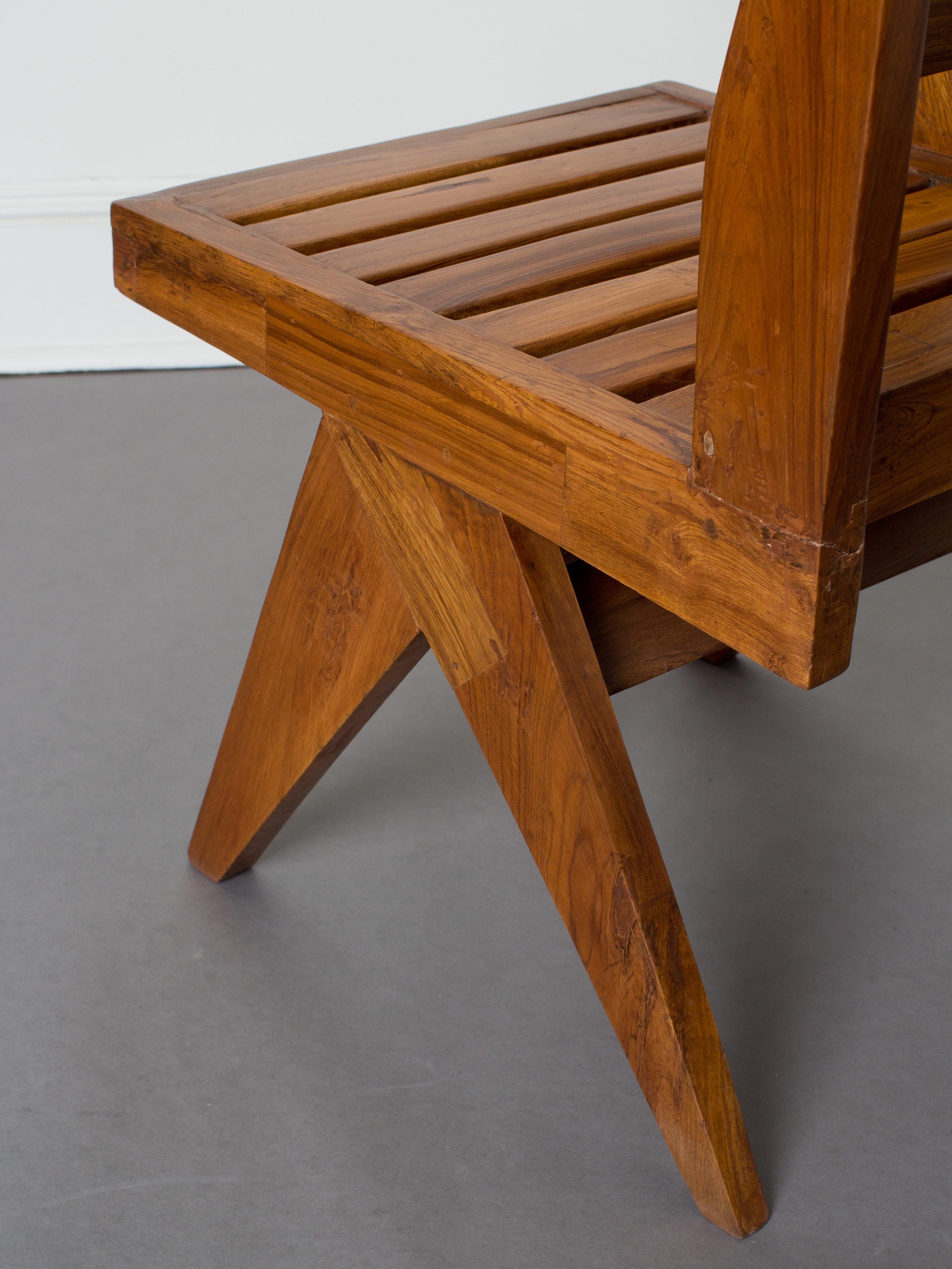 Pierre Jeanneret, Circa 1958
Slatted seat and back, single armed chair in teak.

Provenance: Chandigarh, India.