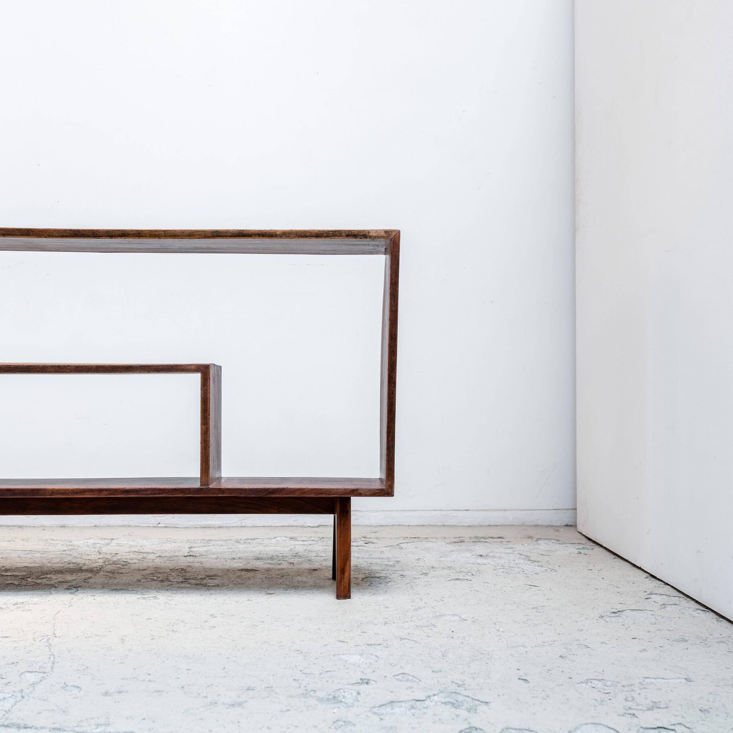 A rare and authentic example from the Chandigarh project in India, this teak 3-holes file rack by Pierre Jeanneret reflects the architect’s rational yet sculptural design language. Characterized by its solid teak construction.

The design embodies