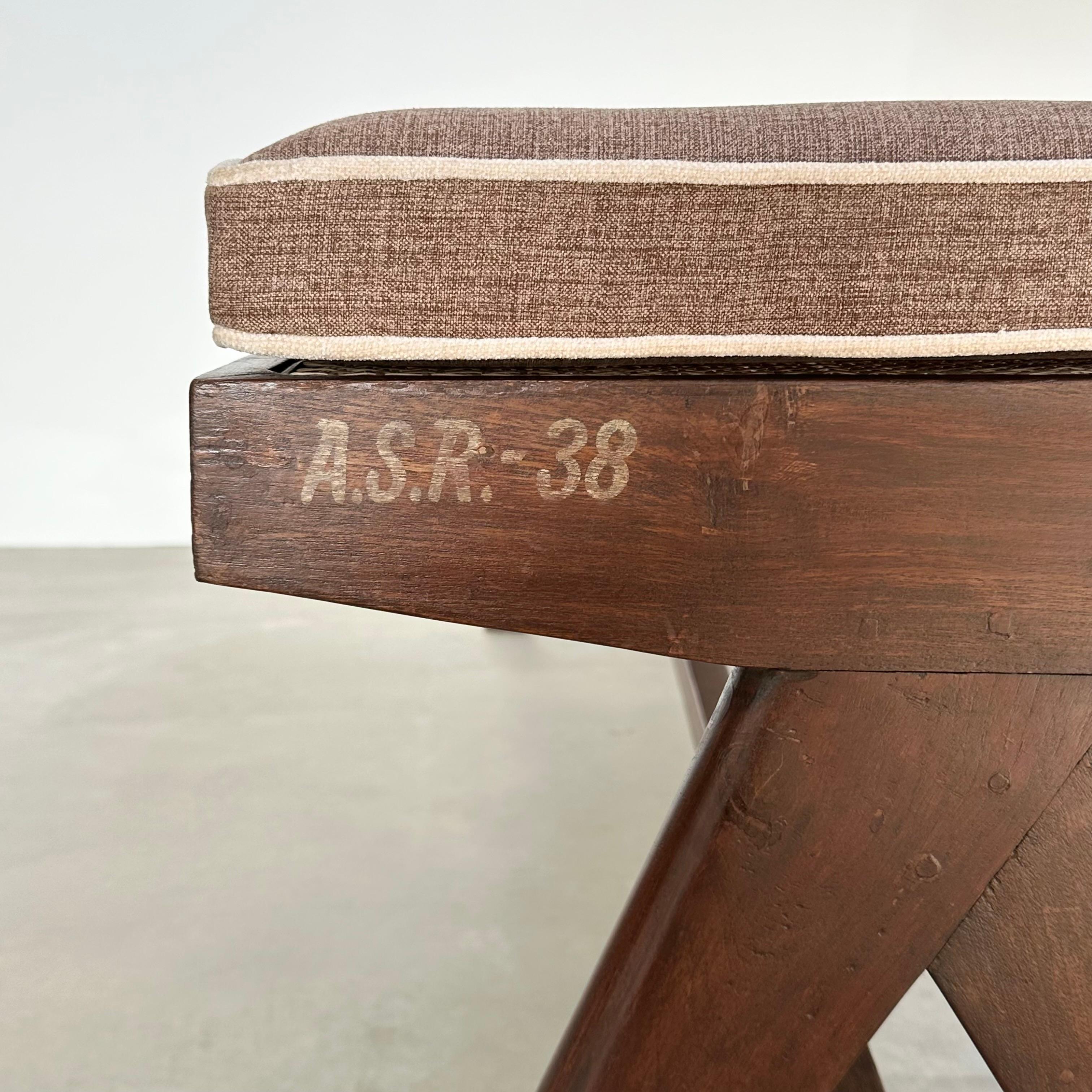 Beautiful teak bench titled the King Bench A Leg designed by Pierre Jeanneret for Chandigarh. Imported from India with care, this bench tell a story far beyond what the eye can see.

The stenciled markings read - 