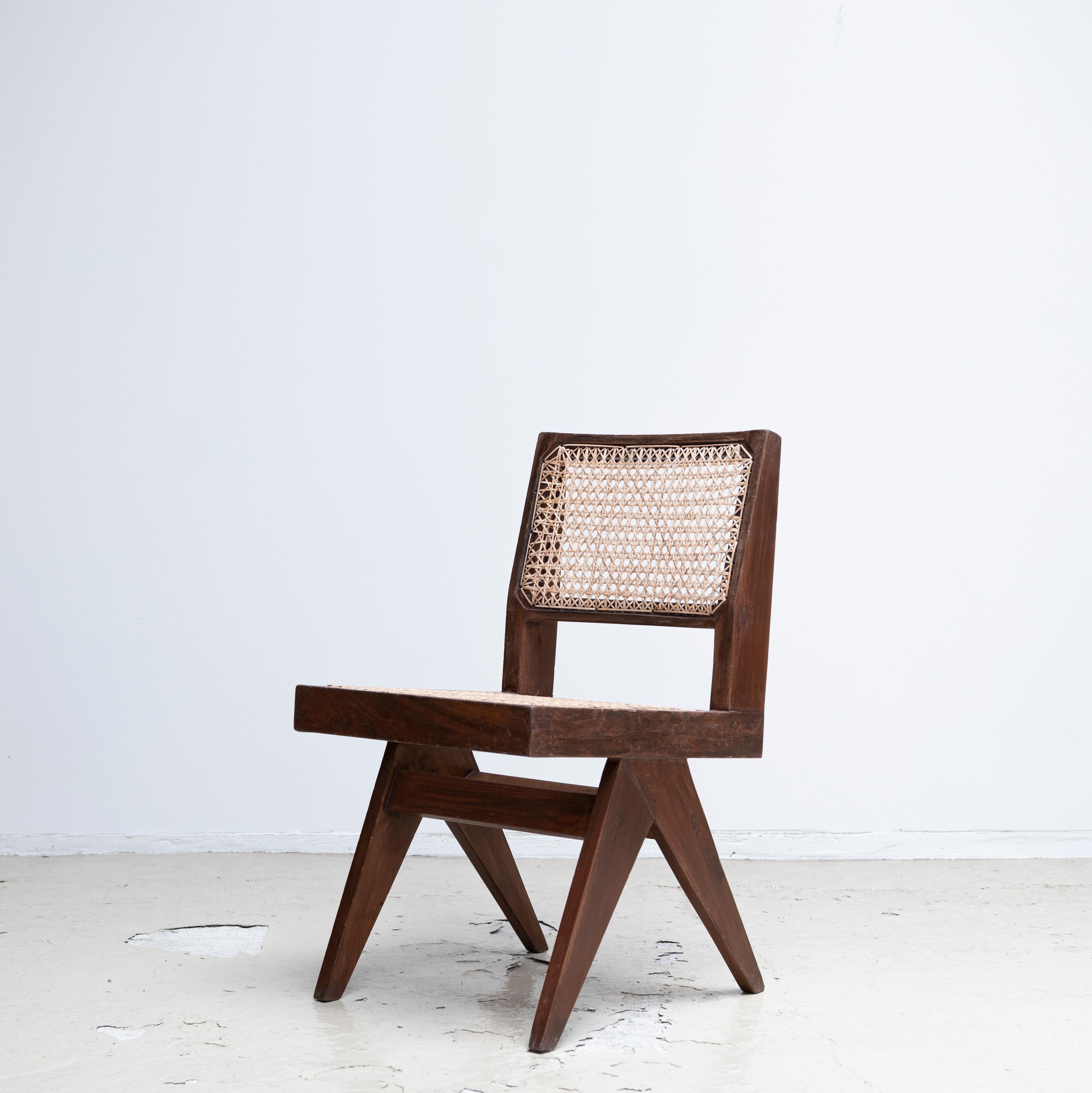 A pair of armless dining chairs designed by Pierre Jeanneret. Circa 1950s.
Provenance: Panjab University Girls Hostel, Chandigarh, India.