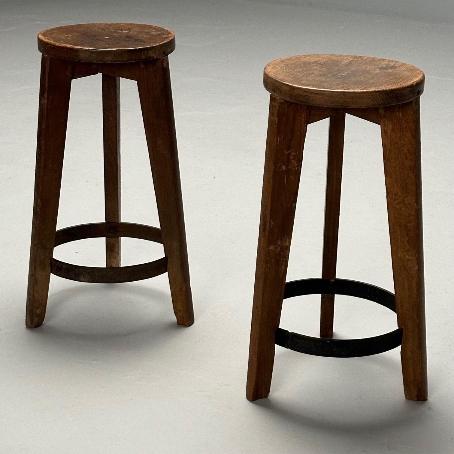 Pierre Jeanneret, French Mid-Century Modern, High Bar Stools, Teak, Chandigarh, India c. 1960s

A pair of round stools with wood seats from Chandigarh, India circa 1965-1966. Great patina with round metal supports toward the bottom of each piece.