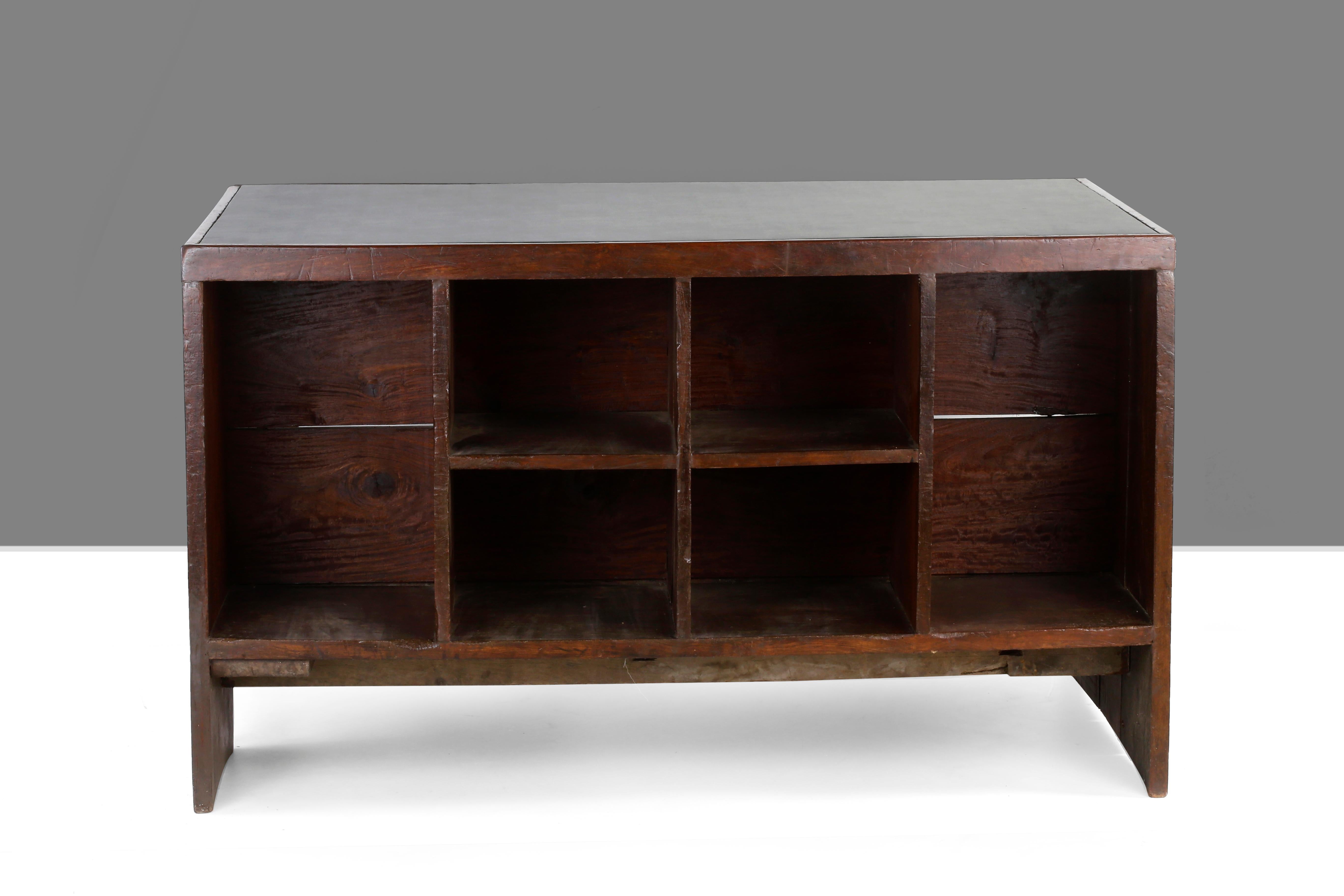 Office desk, 1957-1958. Rectangular top covered in green skai on a frame, affixed on one side by a panel forming a left side leg with a box section including a drawer and compartment and on the other side, a profiled leg with a flat triangular rail.