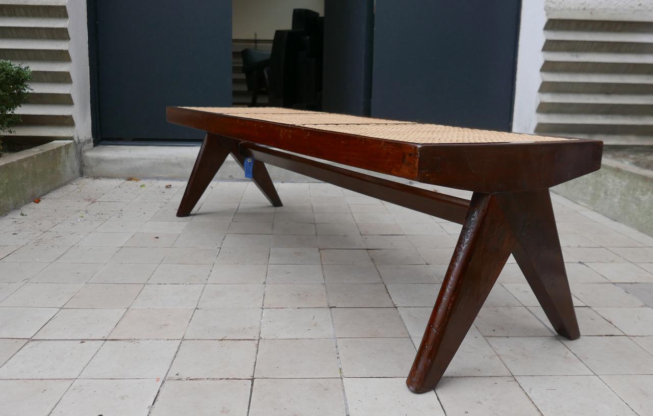 Pierre Jeanneret PJ-SI-33-C 
Important: Vintage collector's item for sale with guaranteed authenticity. 
Caned bench
Solid teak, cane.
Chandigarh, India, M.L.A. Hostel/ Flats (1956).