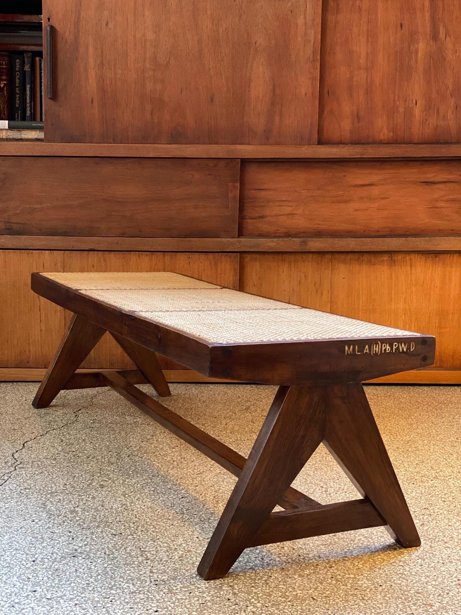 Pierre Jeanneret PJ-SI-33-B 
Important: Vintage collector's item for sale with guaranteed authenticity. 
Caned bench
Solid teak, cane.
Chandigarh, India, M.L.A. Hostel/ Flats (1956).