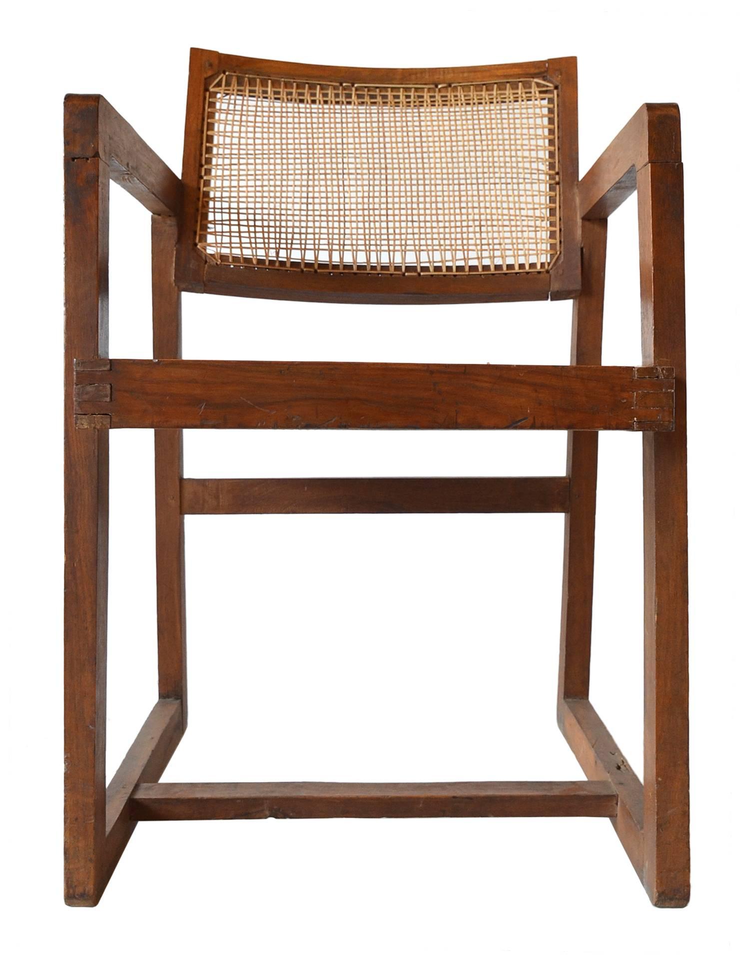 A teak armchair made for the Punjab University in Chandigarh, India, circa 1960.
Model number PJ-SI-53-A
This rare chair is in original as found condition. Only wax and oil have been applied to preserve the original patina and history.
Re-caned