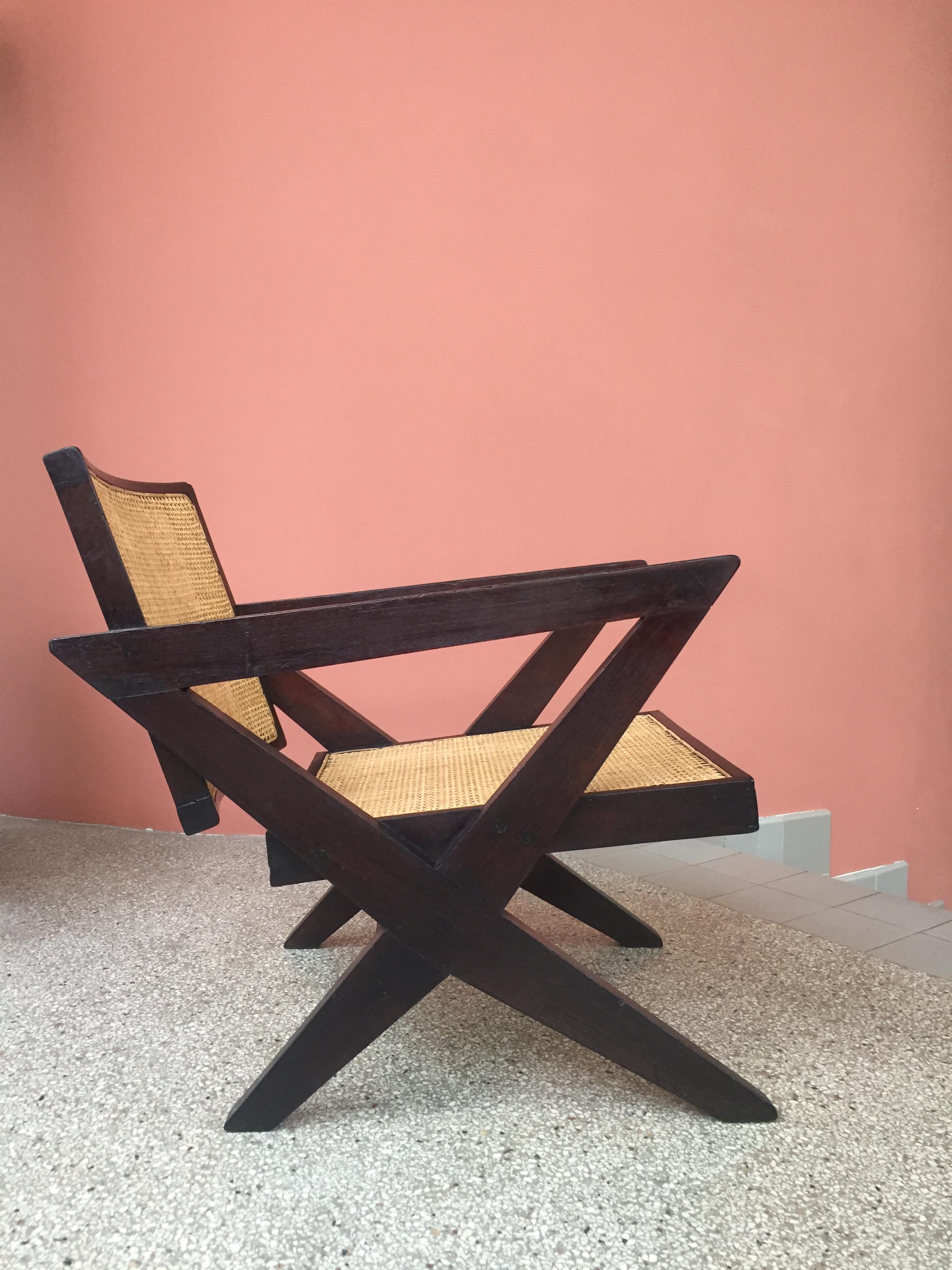 Pierre Jeanneret PJ-SI-45-A 
Important: Vintage collector's item for sale with guaranteed authenticity. 
Solid teak, cane.
Chandigarh, India, M.L.A. Hostel/ Flats (1956).