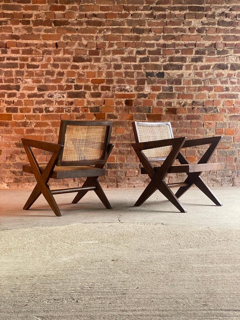 Magnificent mid century Pierre Jeanneret Model PJ-010401 ‘Cross Leg Armchairs’ Chandigarh India Circa 1956 -60, the chairs finished in solid teak, the seat and backrest both with hand braided cane work, the distinctive ”X