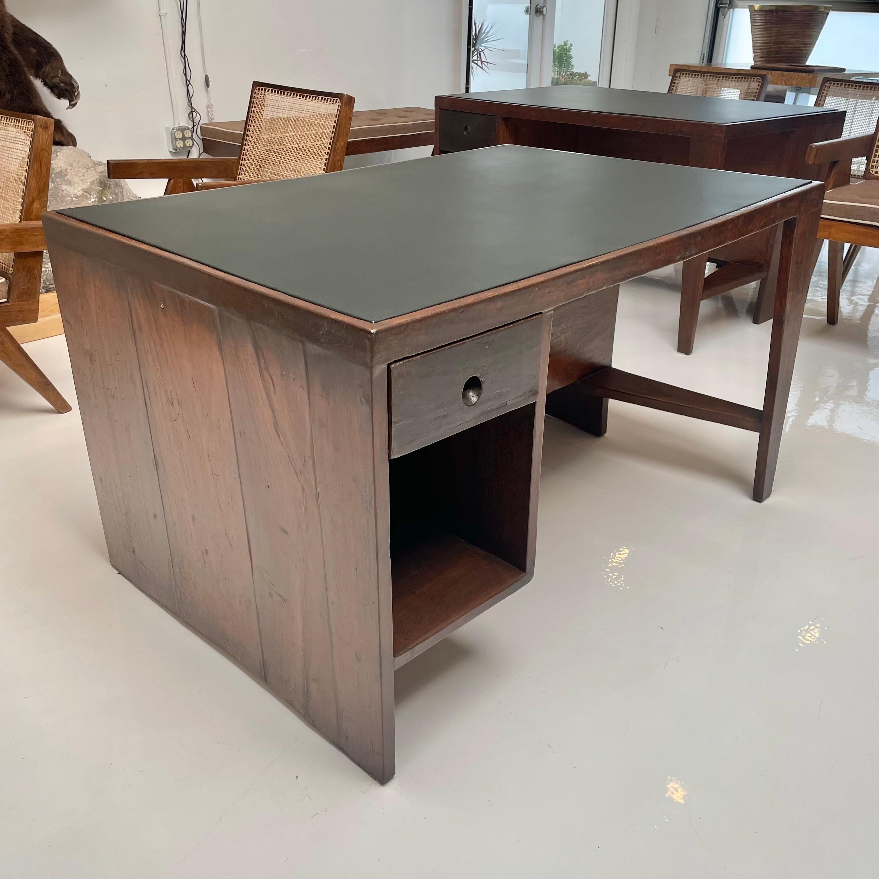 Spectacular pigeonhole desk by Pierre Jeanneret. Made for the Chandigarh project. Used in the administrative buildings in Chindigargh, Sector 1. Angular leg and bookcase back. The word - OFFICE - stenciled on years ago designating it to one of the