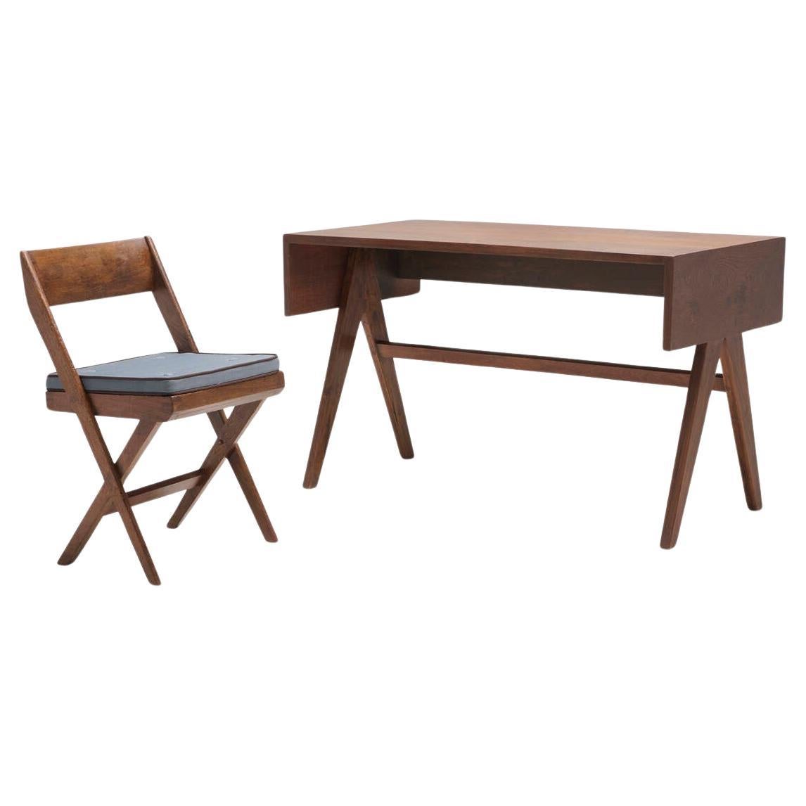 Beautiful set of Pierre Jeanneret desk and chair. The simplicity of the design, yet robust and functional has inspired many versions all over the world, but these original pieces still maintain their unmatched character and patina that distinguishes
