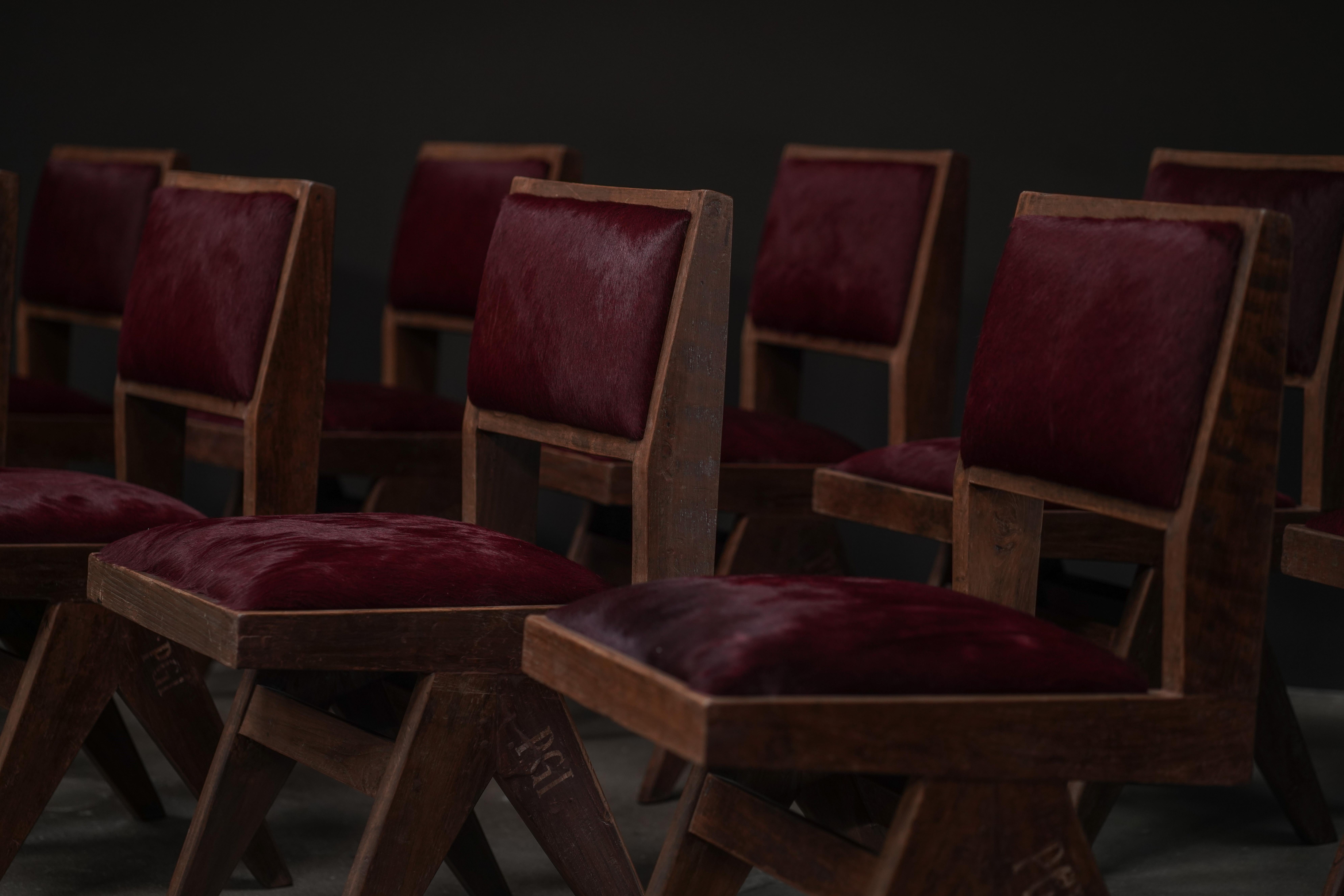 Pierre Jeanneret Dining Chair in Burgundy Hide
Quantity: Upon request 

These are a set of Pierre Jeanneret dining chairs, showcasing the designer's signature Chandigarh aesthetic. Crafted from solid wood with a distinctive V-shaped leg structure,