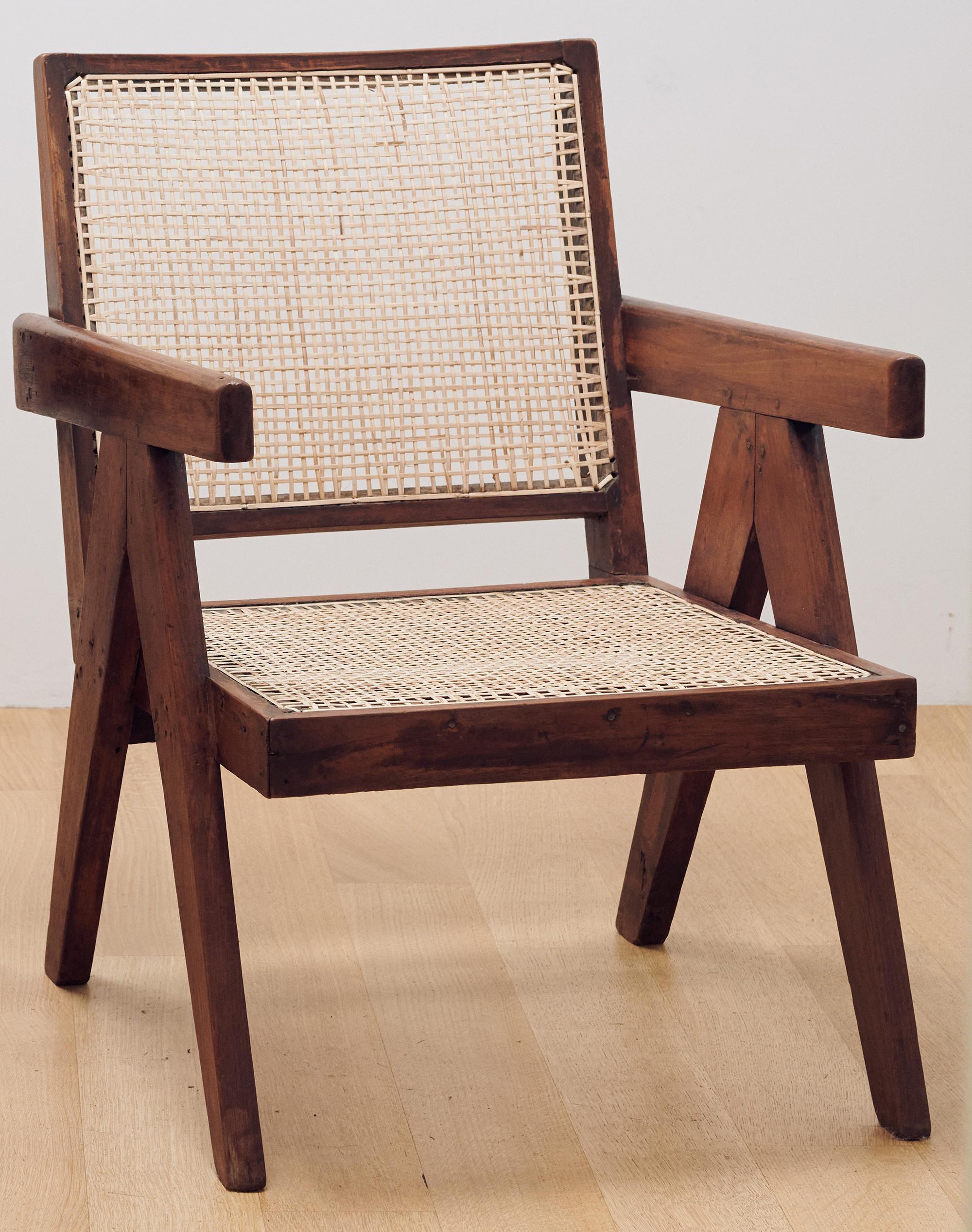 Beautiful antique Easy armchair designed by Pierre Jeanneret for the various public buildings of Chandigarh in the Punjab region of India in the 1950s. Model no. PJ-SI-29-A.* These are solid teak chairs and have been re-caned, there's a patina which