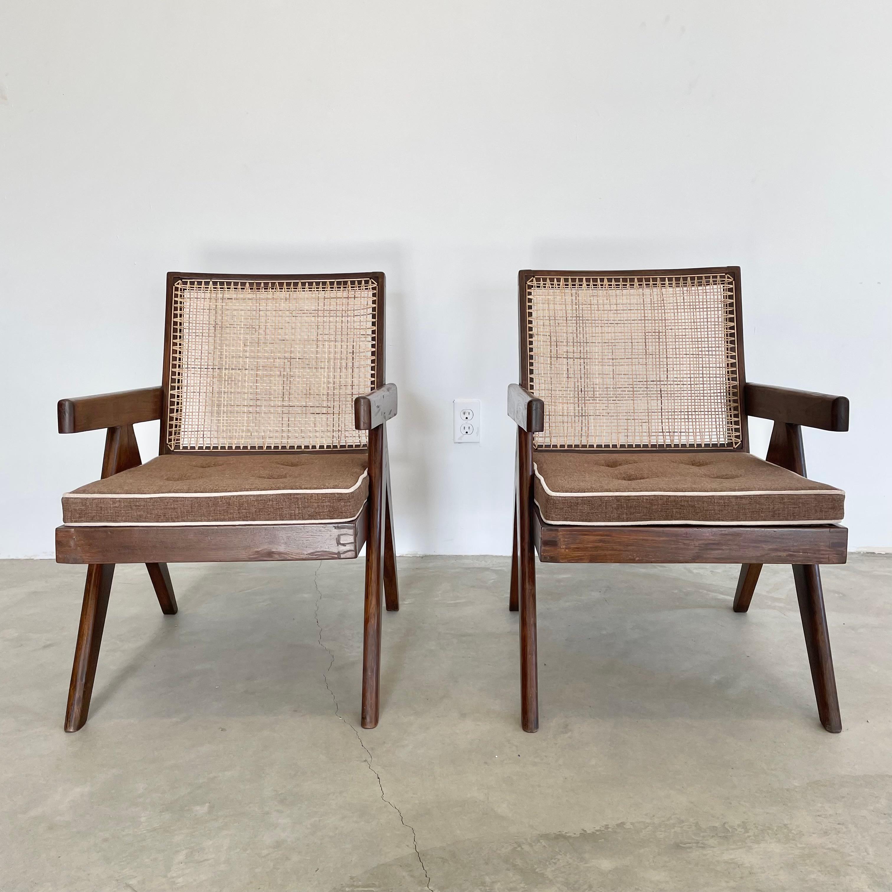 Fantastic collection of Pierre Jeanneret Easy chairs / lounge chairs. Model PJ-SI-29-A. Solid teak chairs with compass style legs, cane seat, and cane seat back. Hand stenciling on the back of both chairs reads : Ch.L.(P)-072 and Ch.L.(P)-044