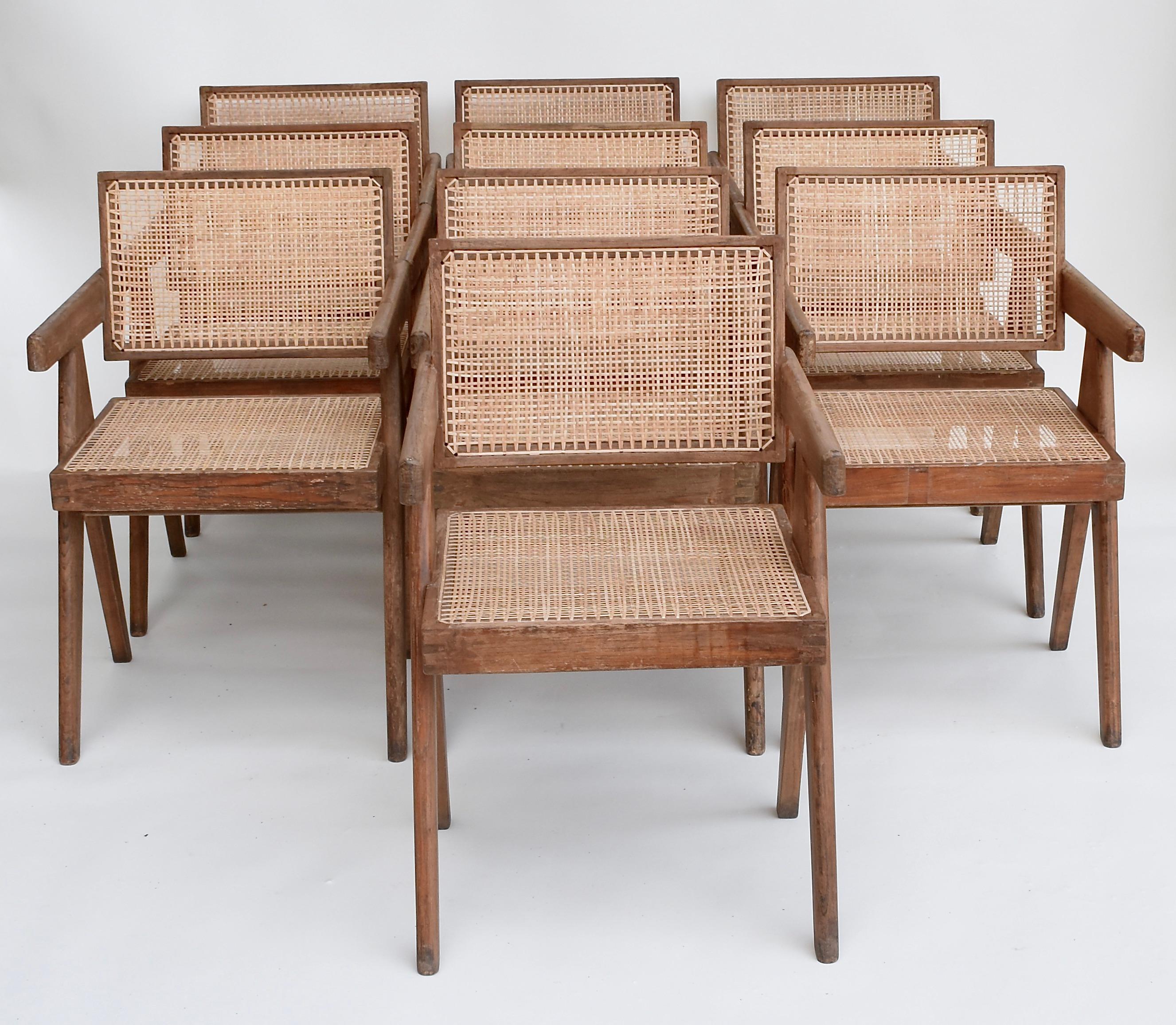 A set of 10 Pierre Jeanneret floating back office chairs in a beautiful natural teak color.  All chairs are in good vintage condition. 
The braided canework has been replaced.
These iconic pieces were part of the administrative buildings in