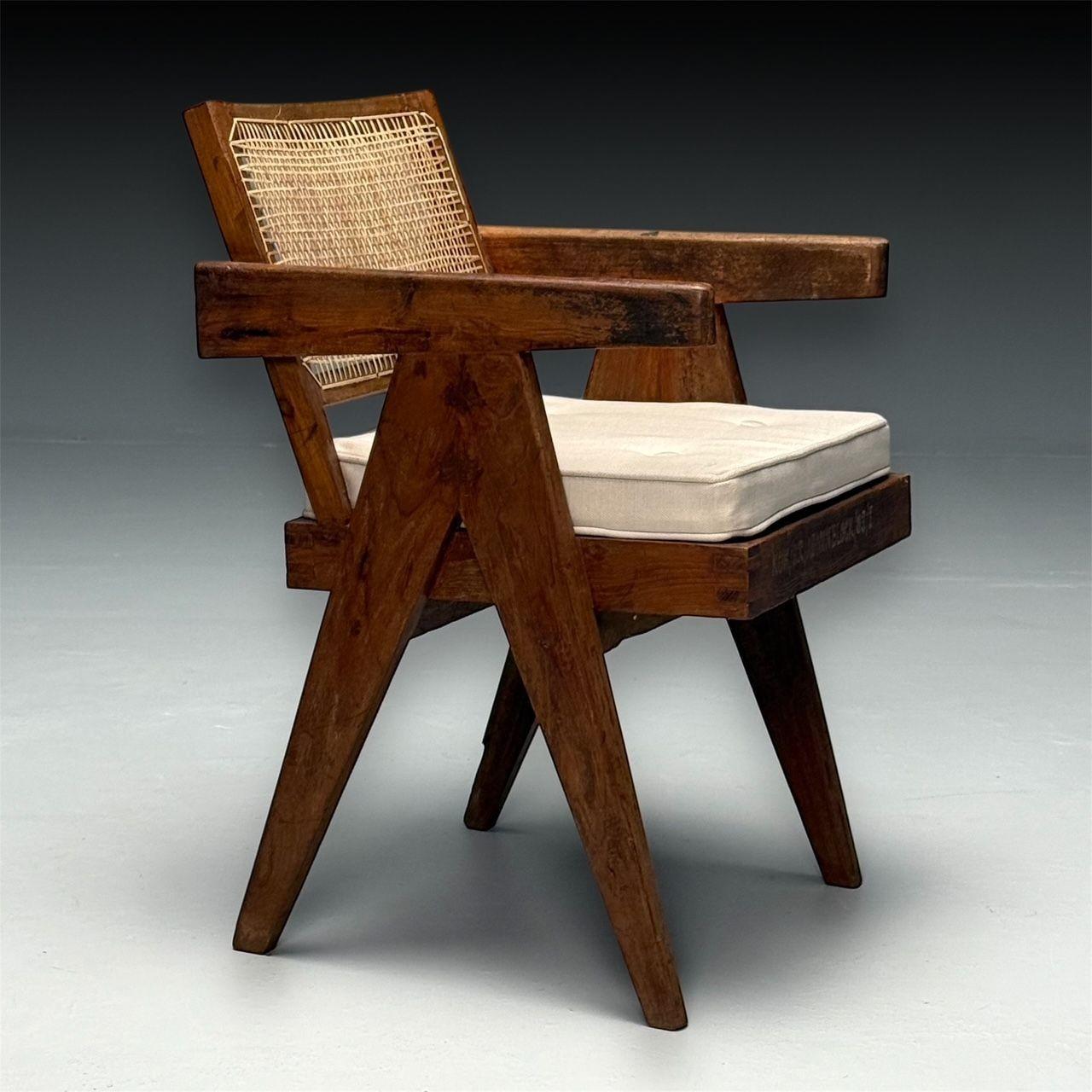 Pierre Jeanneret, French Mid-Century Modern, Office Chair, Model PJ-SI-28-B, Chandigarh c. 1960s

Single fixed back arm chairs in teak and cane featuring a compass type double leg assembly with a slightly curved backrest. This chair comes with a new