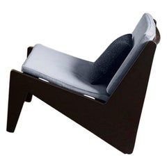 Poltrona bassa Pierre Jeanneret, legno e canna con cuscini by Cassina