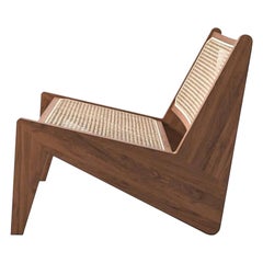 Poltrona bassa Pierre Jeanneret Kangaroo, legno e canna viennese intrecciata di Cassina