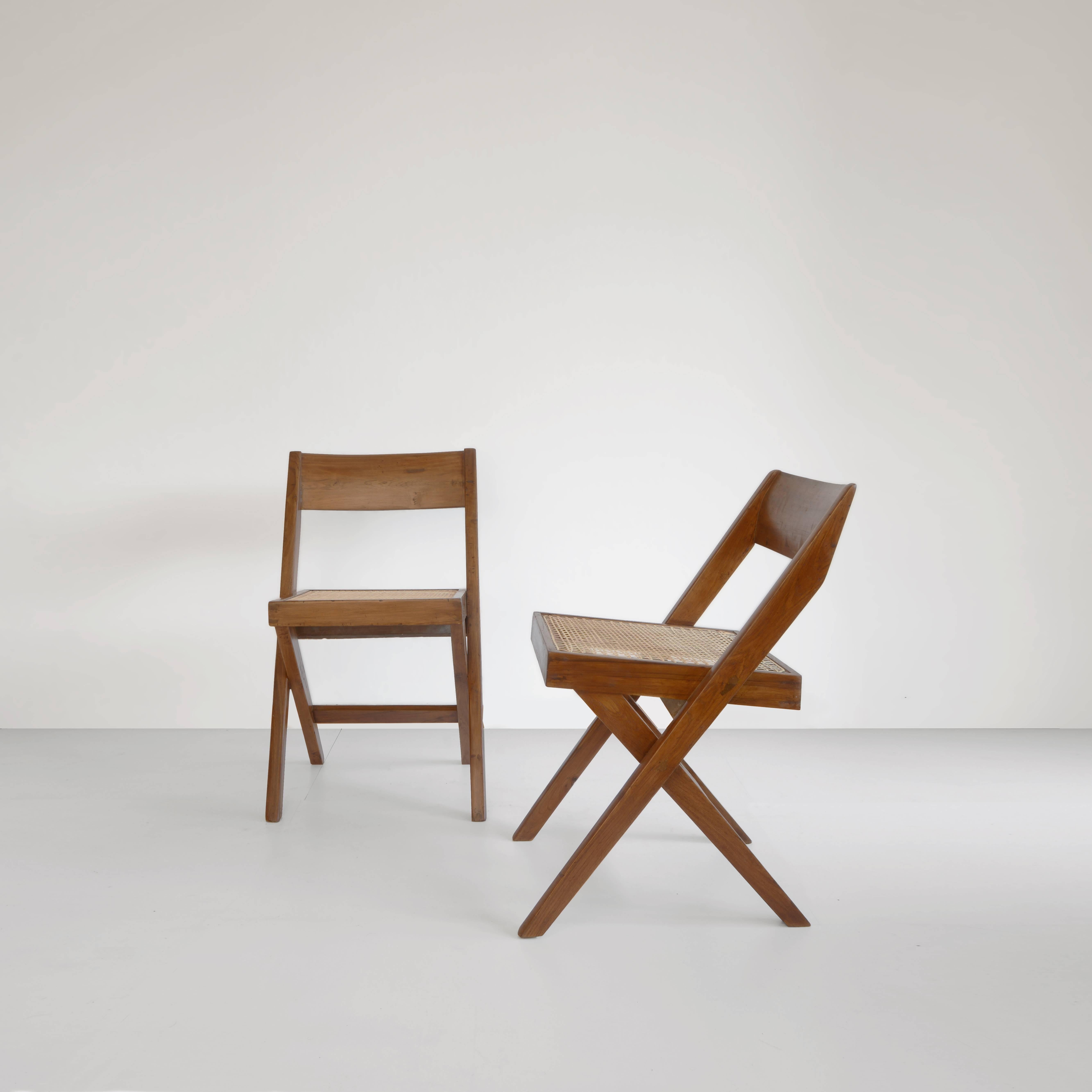 We can make a set of 10 of them.

Chair, 1959-1960. Designed for the University Library and the High Court. Completely restored. Wonderful patina on the fantastic teak. Cane is redone in 2016. You get a cushion too. A simple looking chair with a