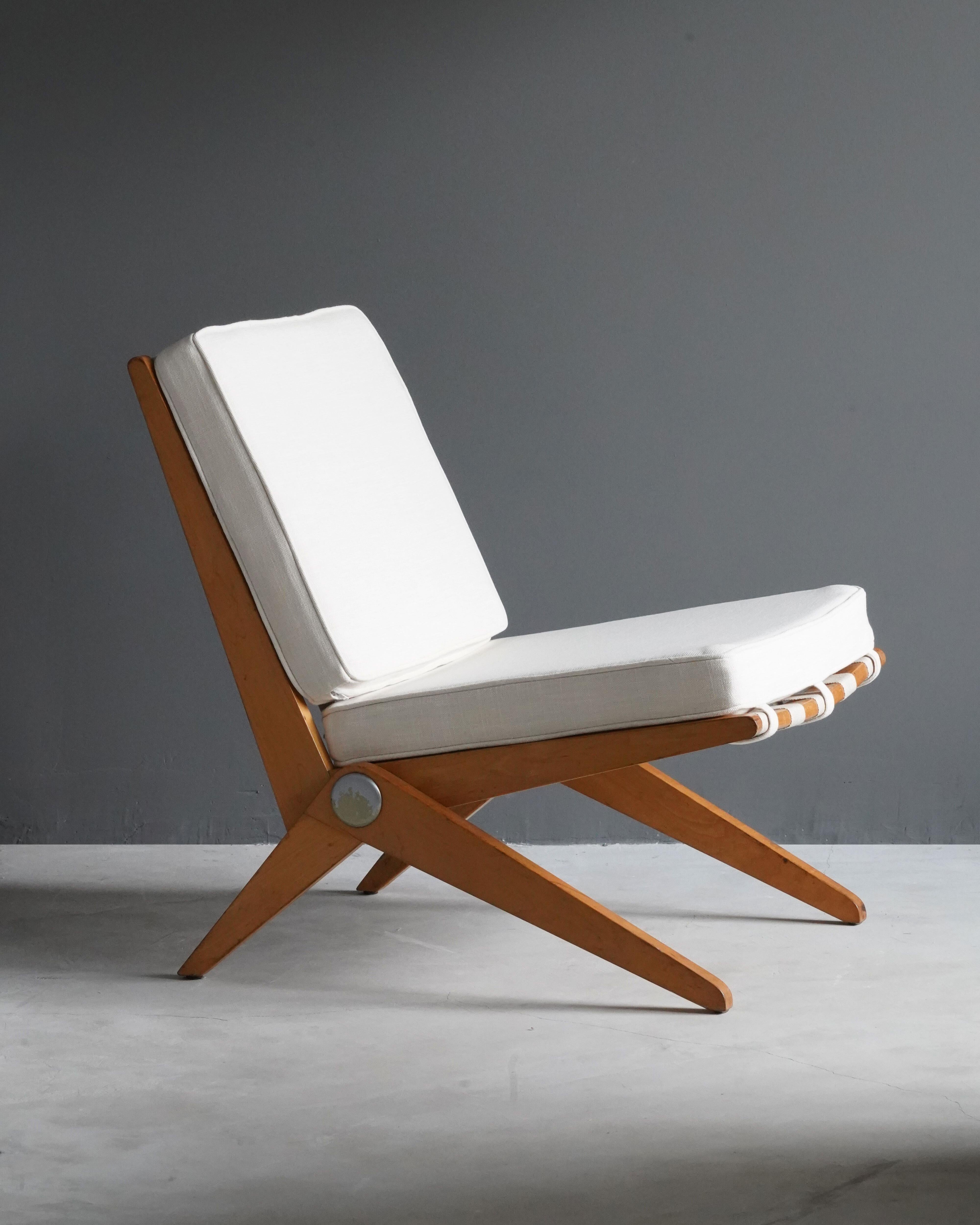 A lounge chair / slipper chair. Designed by Pierre Jeanneret. Produced by Knoll, America, 1950s.

Other designers of the period include Jean Prouvé, Charlotte Perriand, Isamu Noguchi, George Nakashima, and Paul Frankl.