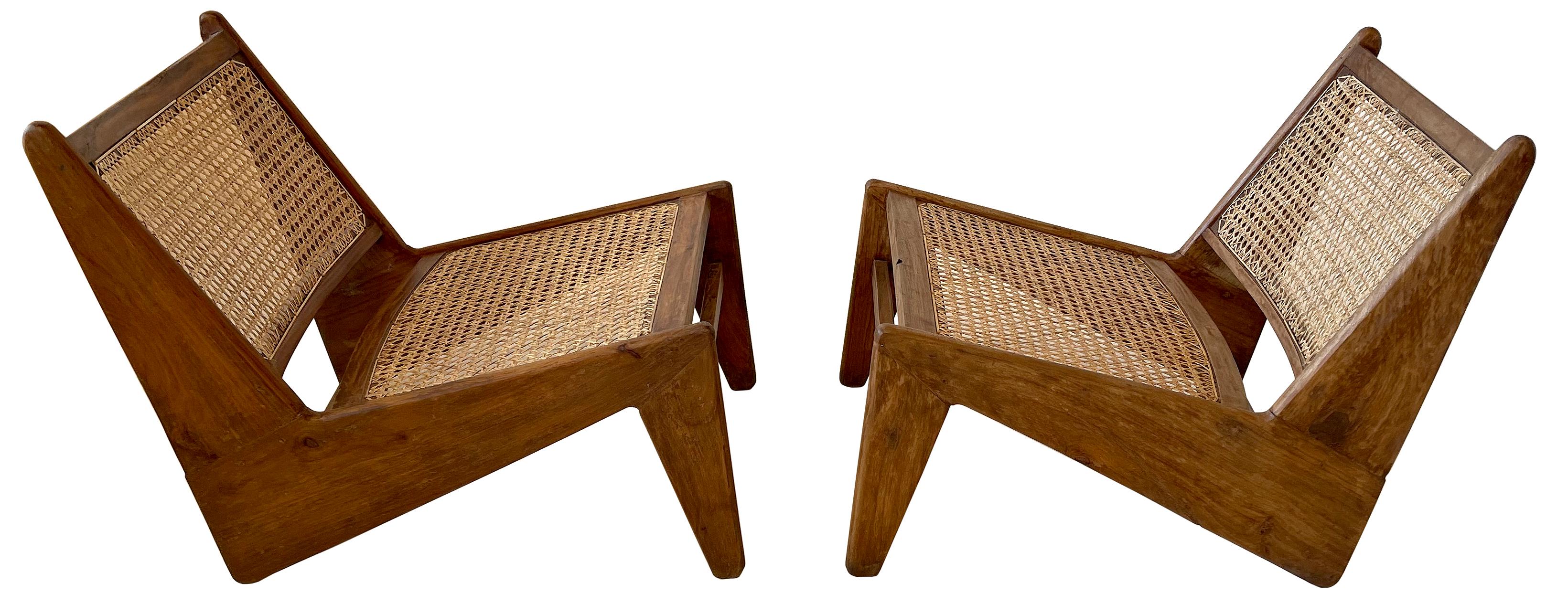 A really terrific pair of rare low lounge chairs in teak and Indian Sissoo wood.

A true matched pair as indicated by the numbered designation on the rear of the seat-backs. 
In beautiful sympathetically restored condition. Secured and shored