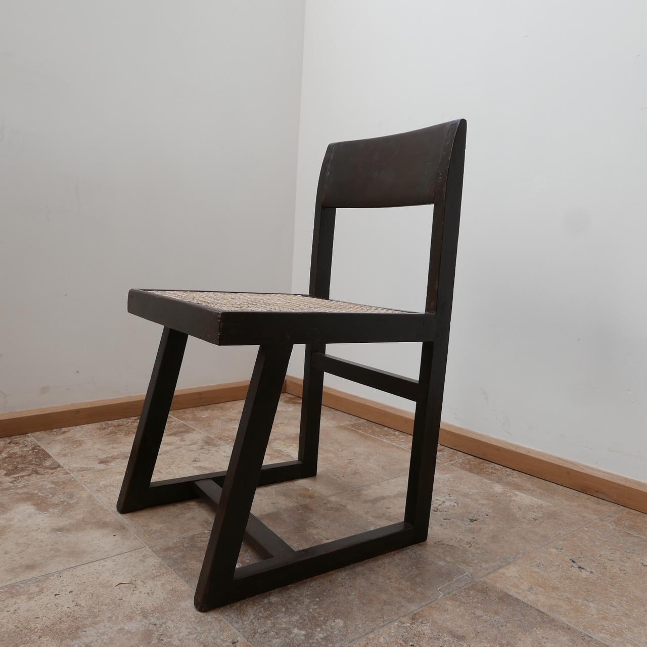 A rare chair by Pierre Jeanneret. 

India, c1960s. 

Model: PJ-SI-54-A. 

Teak and cane. 

Perfect for an office chair or vanity chair. 

Measures: 40 W x 45 D x 43.5 seat height x 76.5 total height in cm.


  