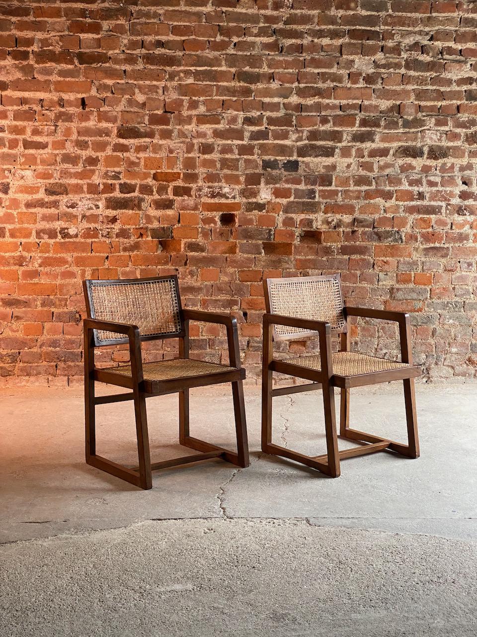 Pierre Jeanneret Model: PJ-010201 teak armchairs ‘Mono Bloc’ pair Chandigarh Circa 1960

Pierre Jeanneret Model: PJ-010201 Teak Armchairs ‘Fauteuil En Teck’ also known as ‘Cane Seat, Cane Back Office Chair’ Chandigarh India, circa 1960, the solid